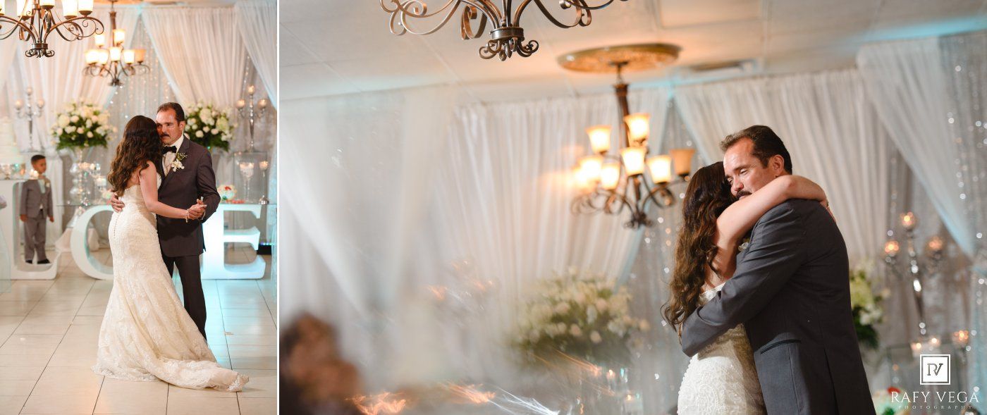 Bride and groom sharing romantic first dance under white draped ceiling with chandeliers and floral arrangements.