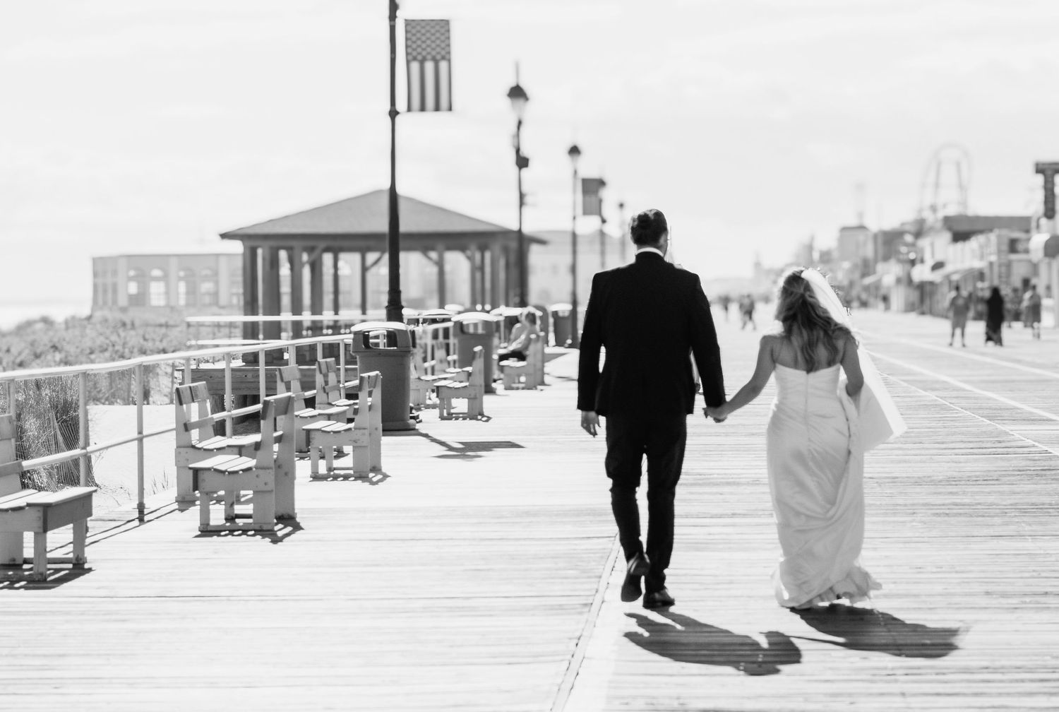 Bride and groom candid moment wedding day NJ. Ocean city NJ, beach portraits.