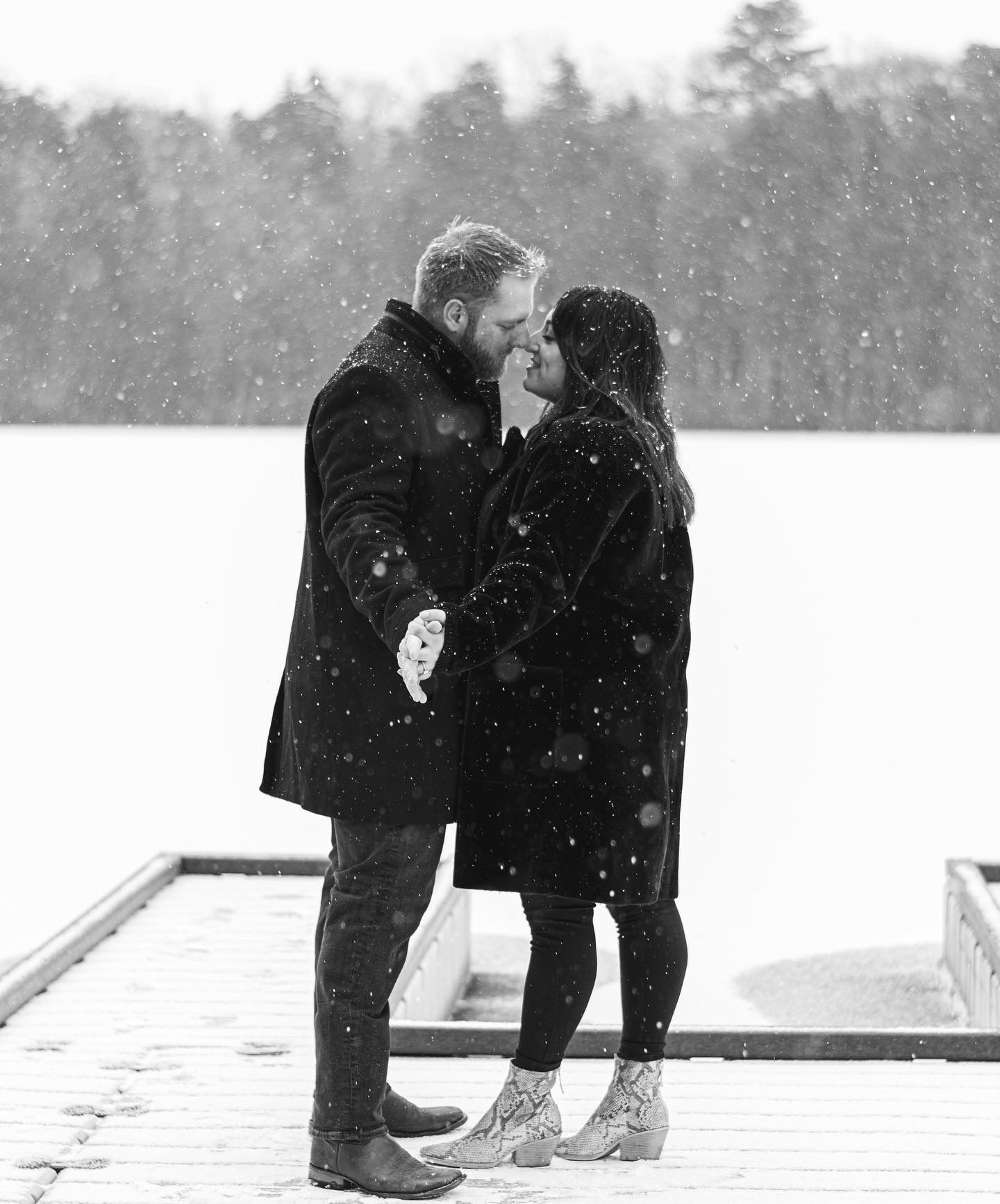 Couples snowy engagement session South Jersey on a boat dock.