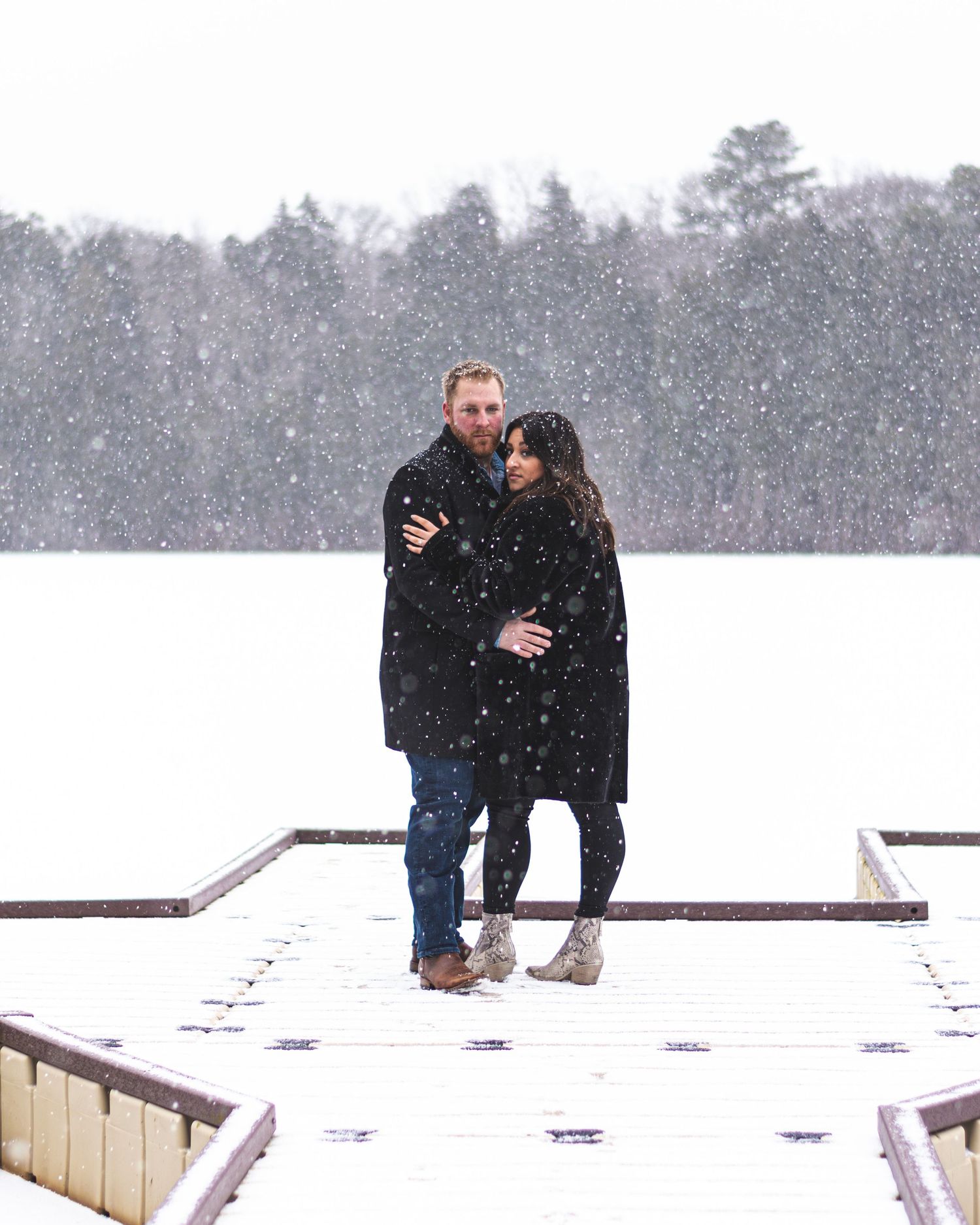 Couples snowy engagement session South Jersey on a boat dock.