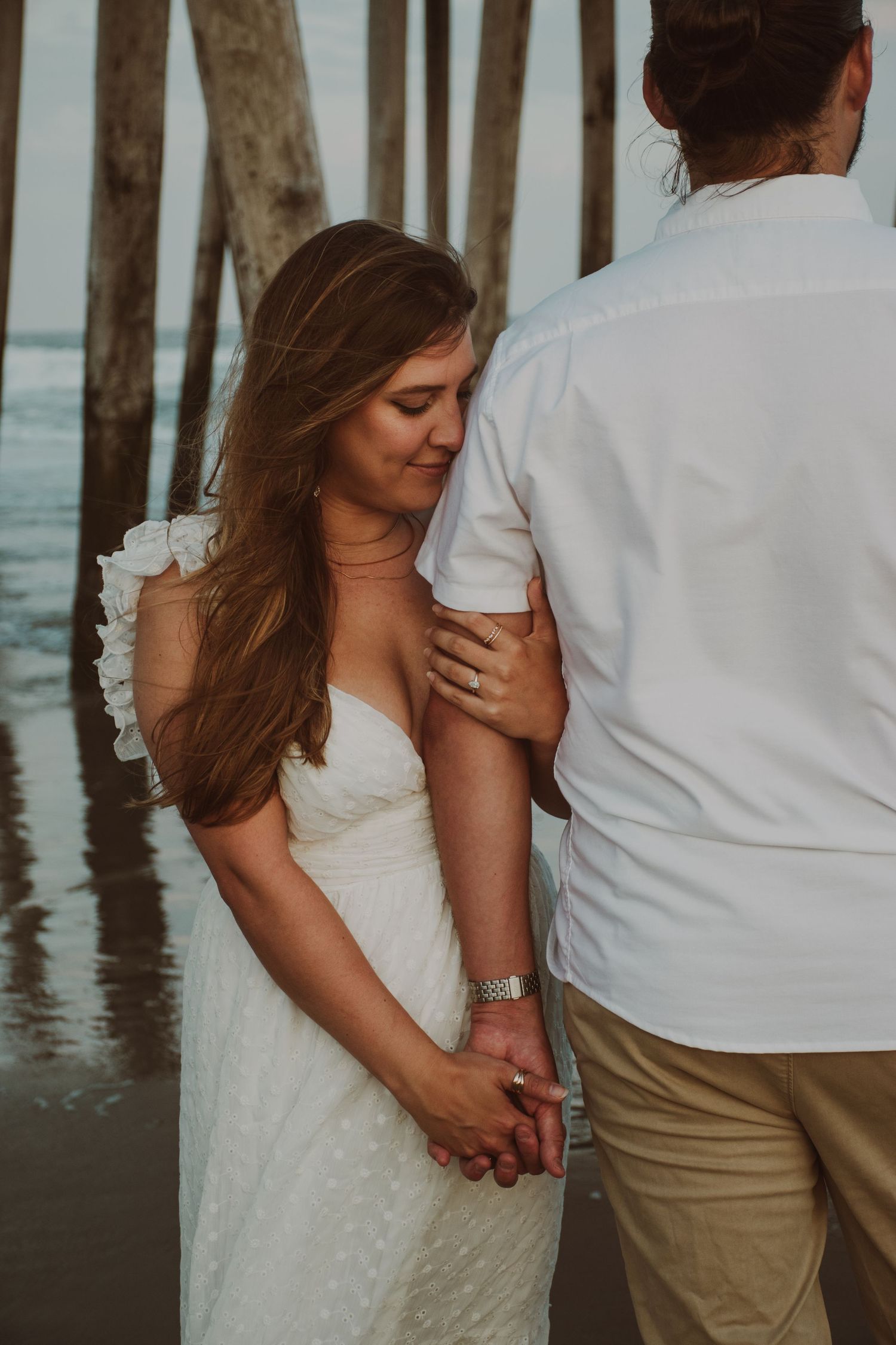 Couple standing together on beach romantic portrait South Jersey