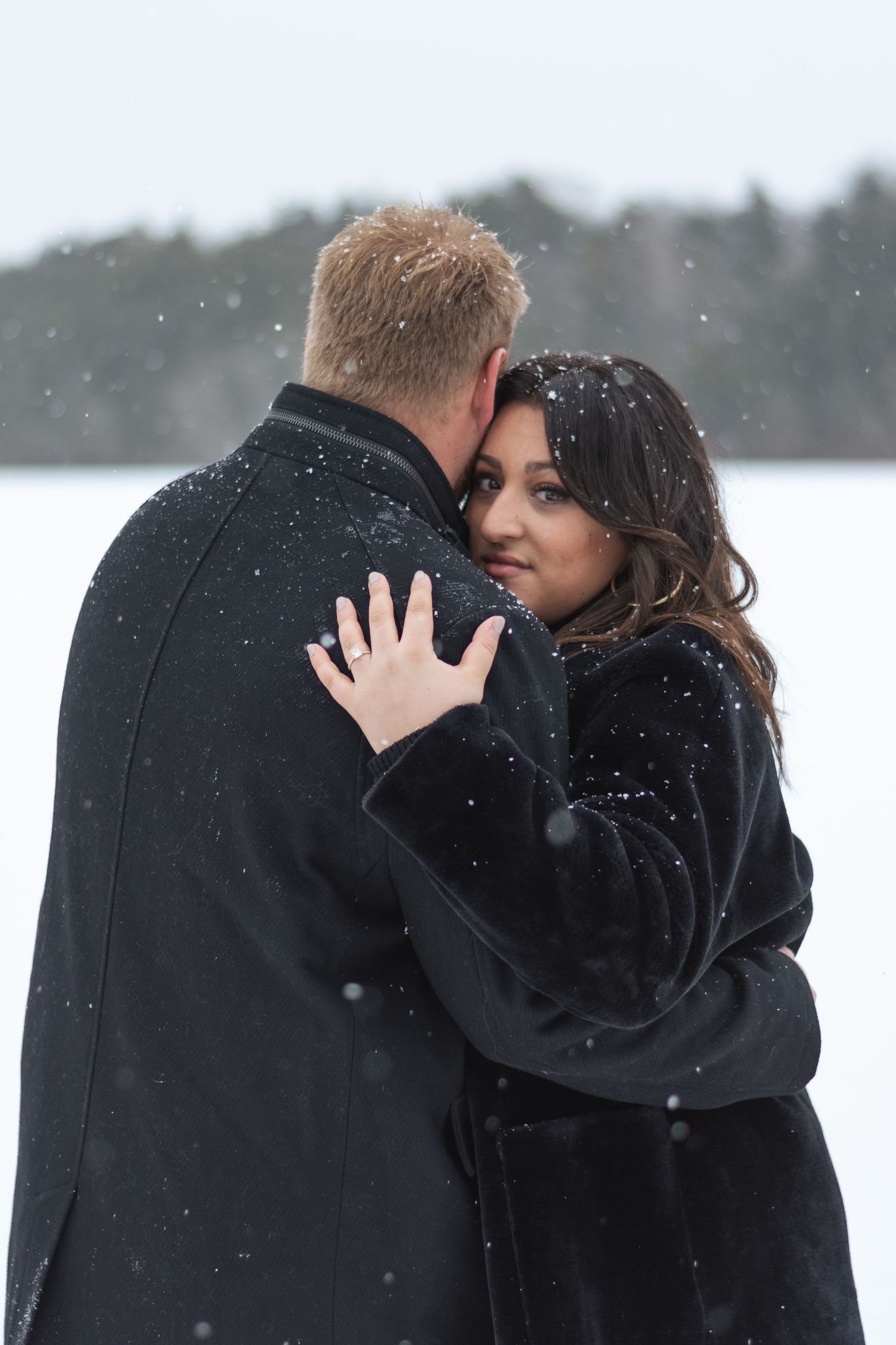 Couples snowy engagement session South Jersey on a boat dock.