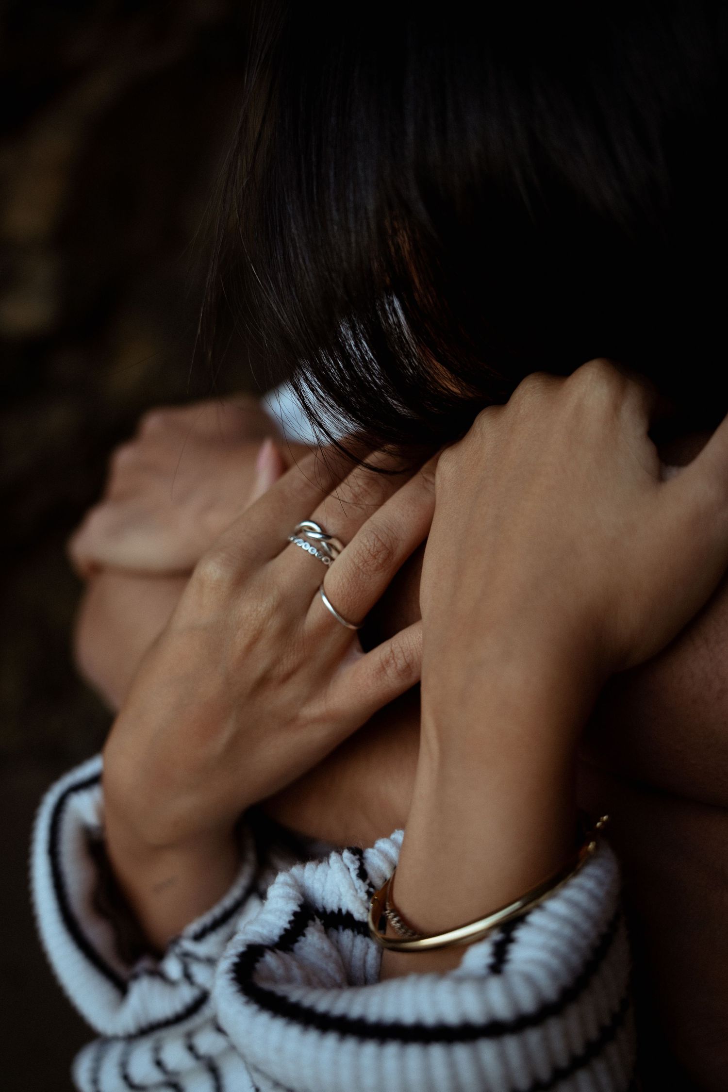 A close-up of a couple's hands with rings during a couples photography session in Portugal