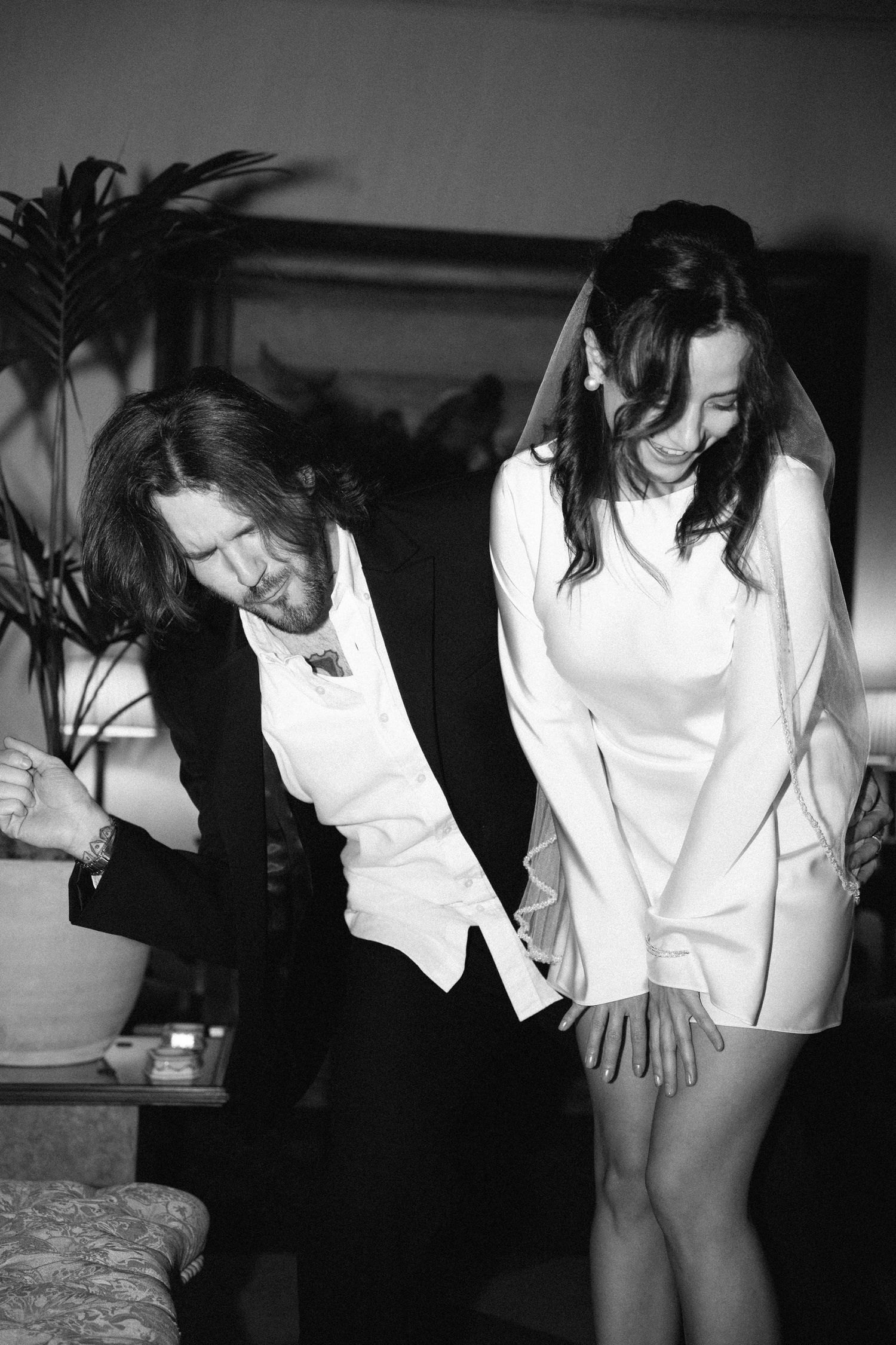 Couple dancing together in black and white film photo, elopement at Estoril Vintage Hotel Portugal