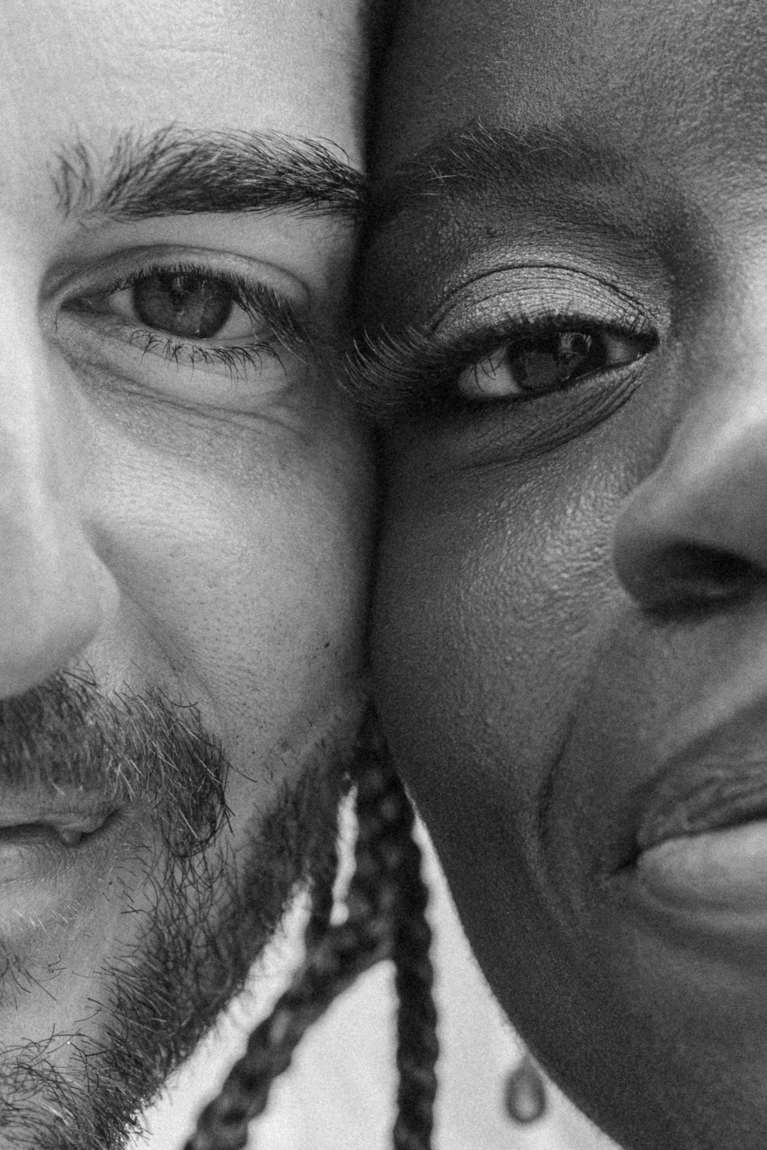 A close-up black and white portrait of a bride and groom during their wedding portrait session in Portugal