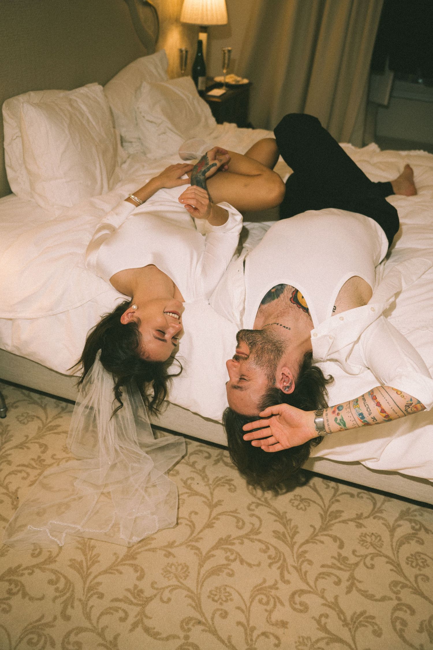 Bride and groom relaxing on wedding morning in Estoril Vintage Hotel room, elopement photographer Lisbon