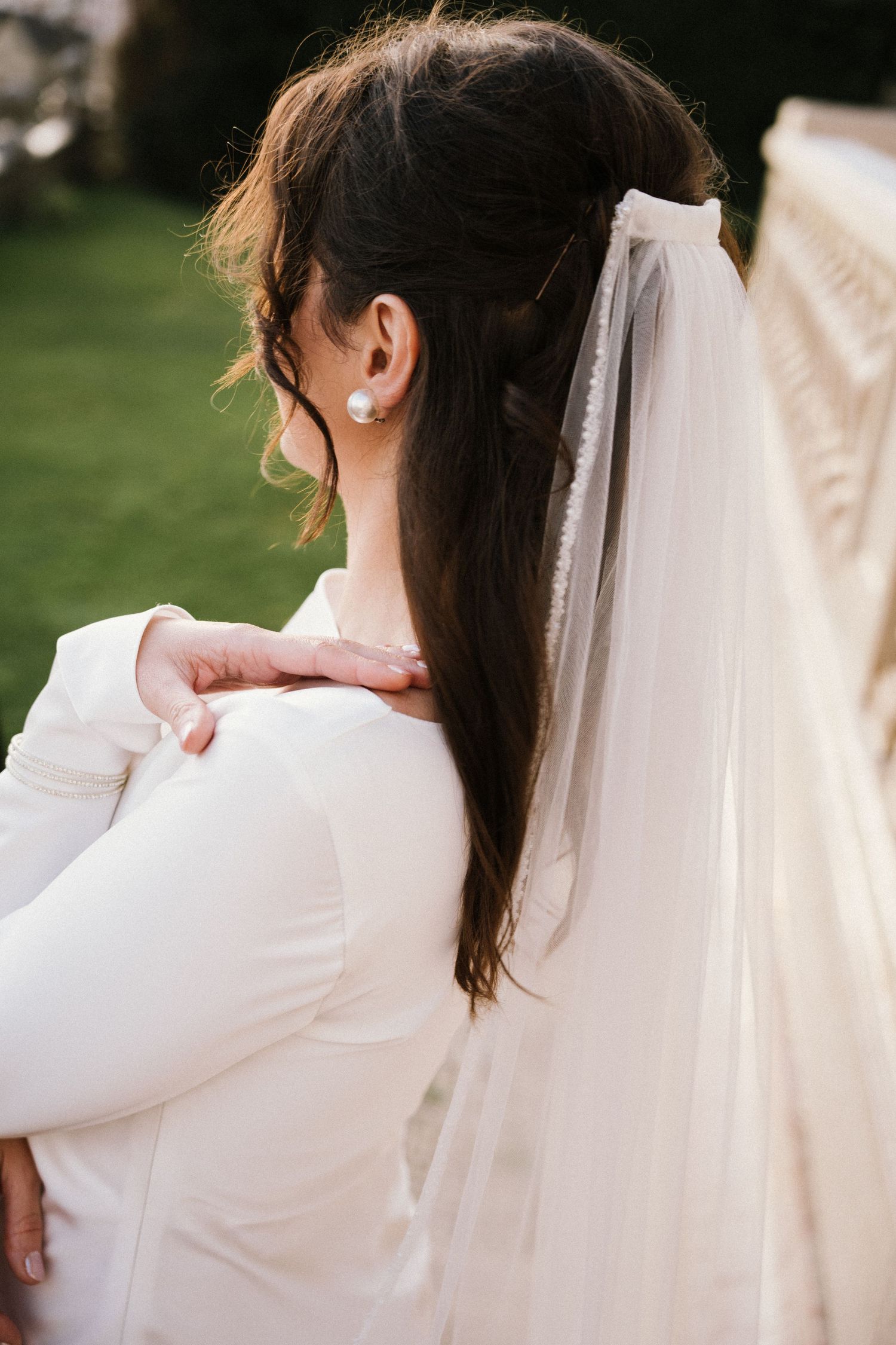 A bride in a wedding dress and flowing veil during her elopement in Portugal