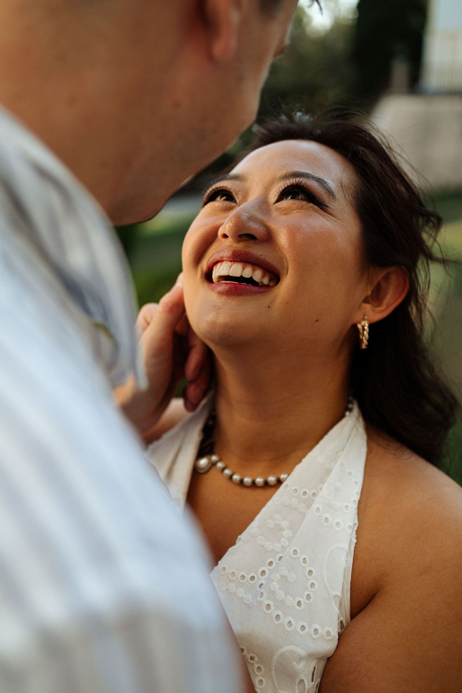 A bride laughing joyfully during her engagement photoshoot in Portugal