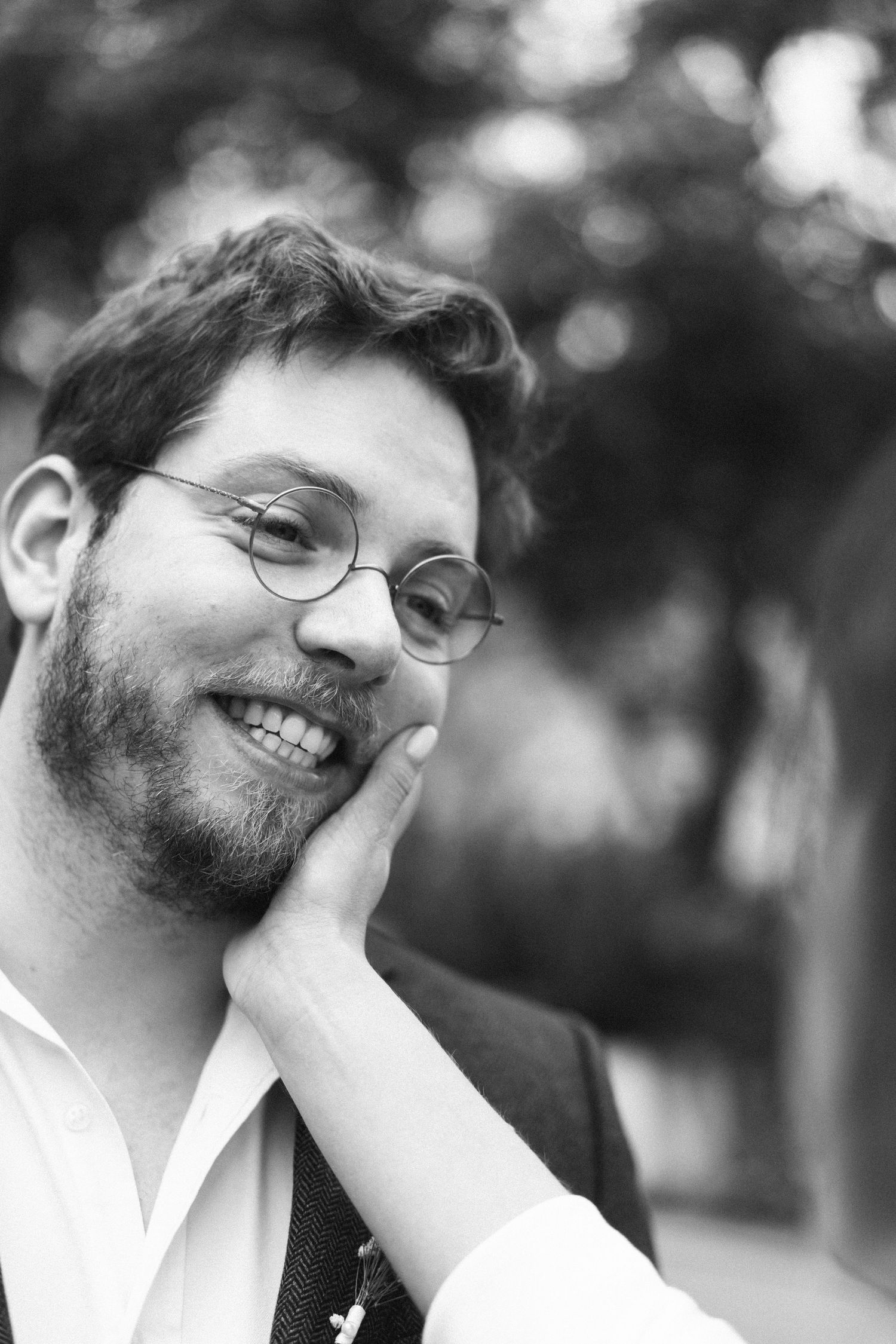 A candid portrait of the groom smiling during an intimate elopement at Lawrence's Hotel in Sintra, Portugal