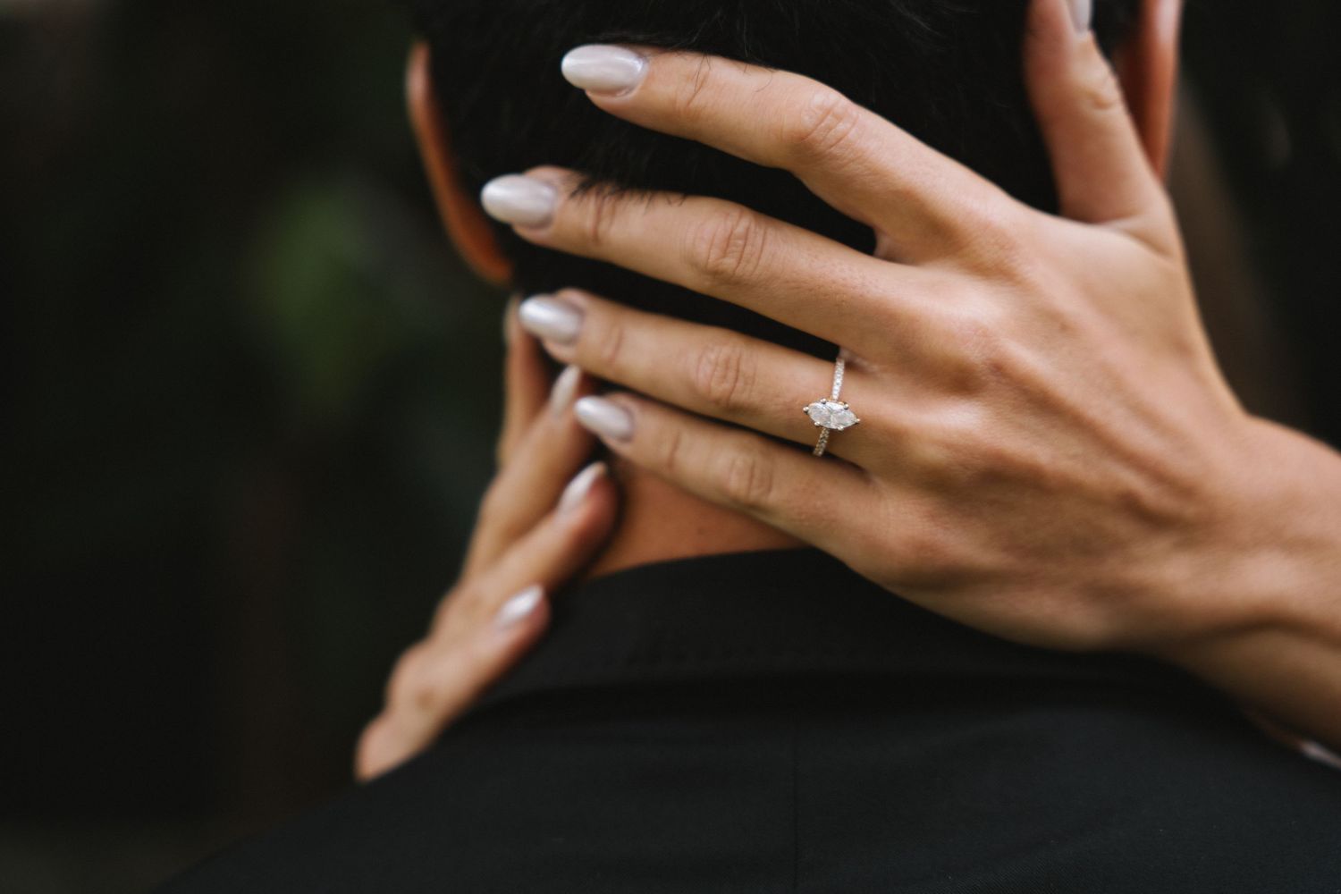 A close-up of a bride's hand showing her engagement ring during a pre-wedding session in Lisbon, Portugal