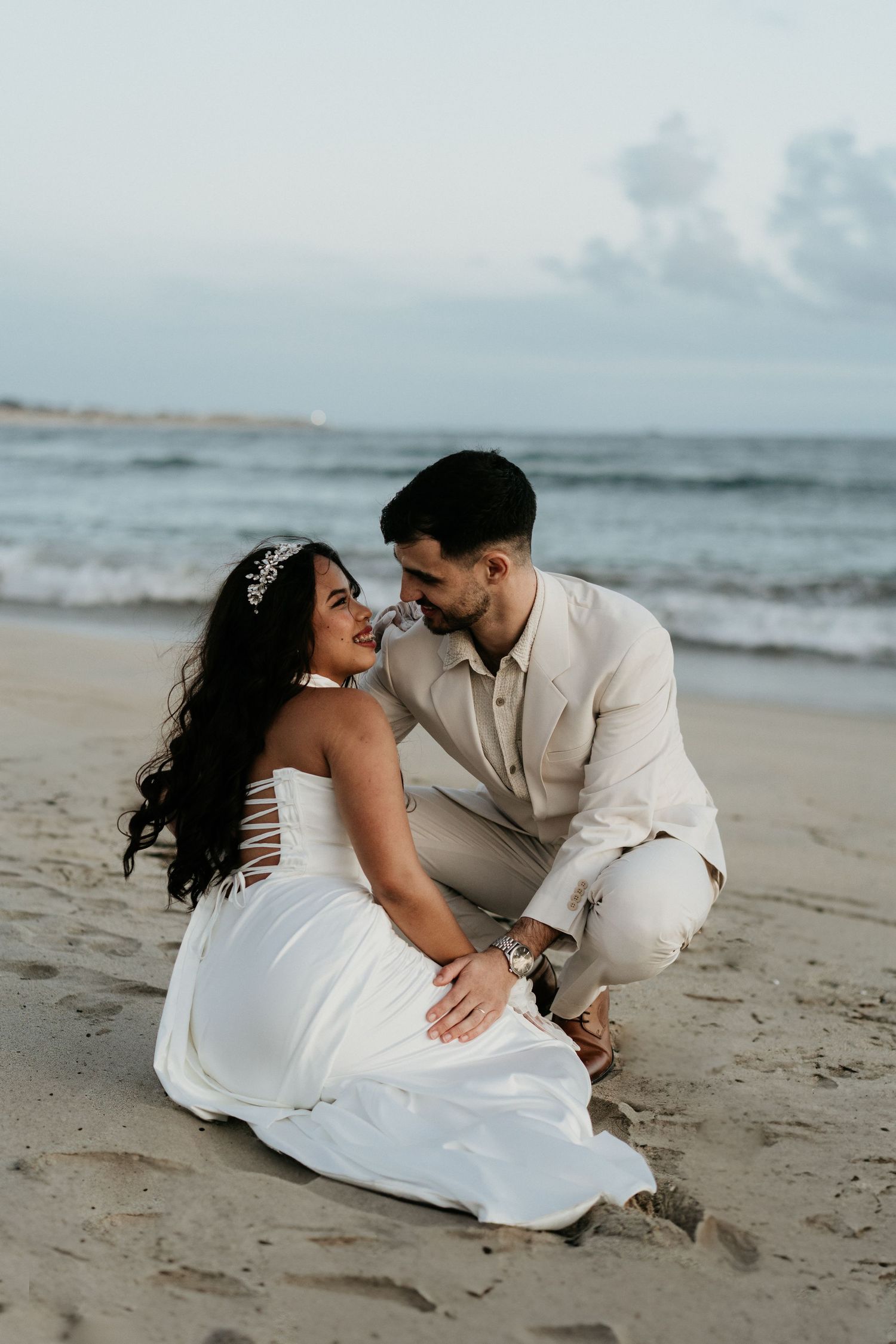 Couple embracing on beach during wedding ceremony, Praia da Azurara Porto Portugal