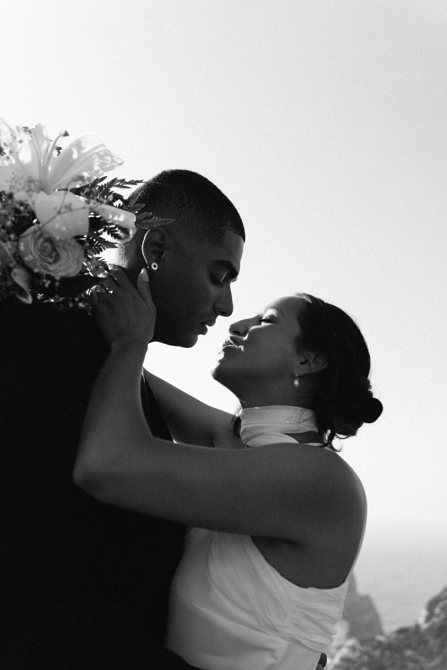 A black and white close-up of a couple sharing a tender moment during an elopement in Portugal