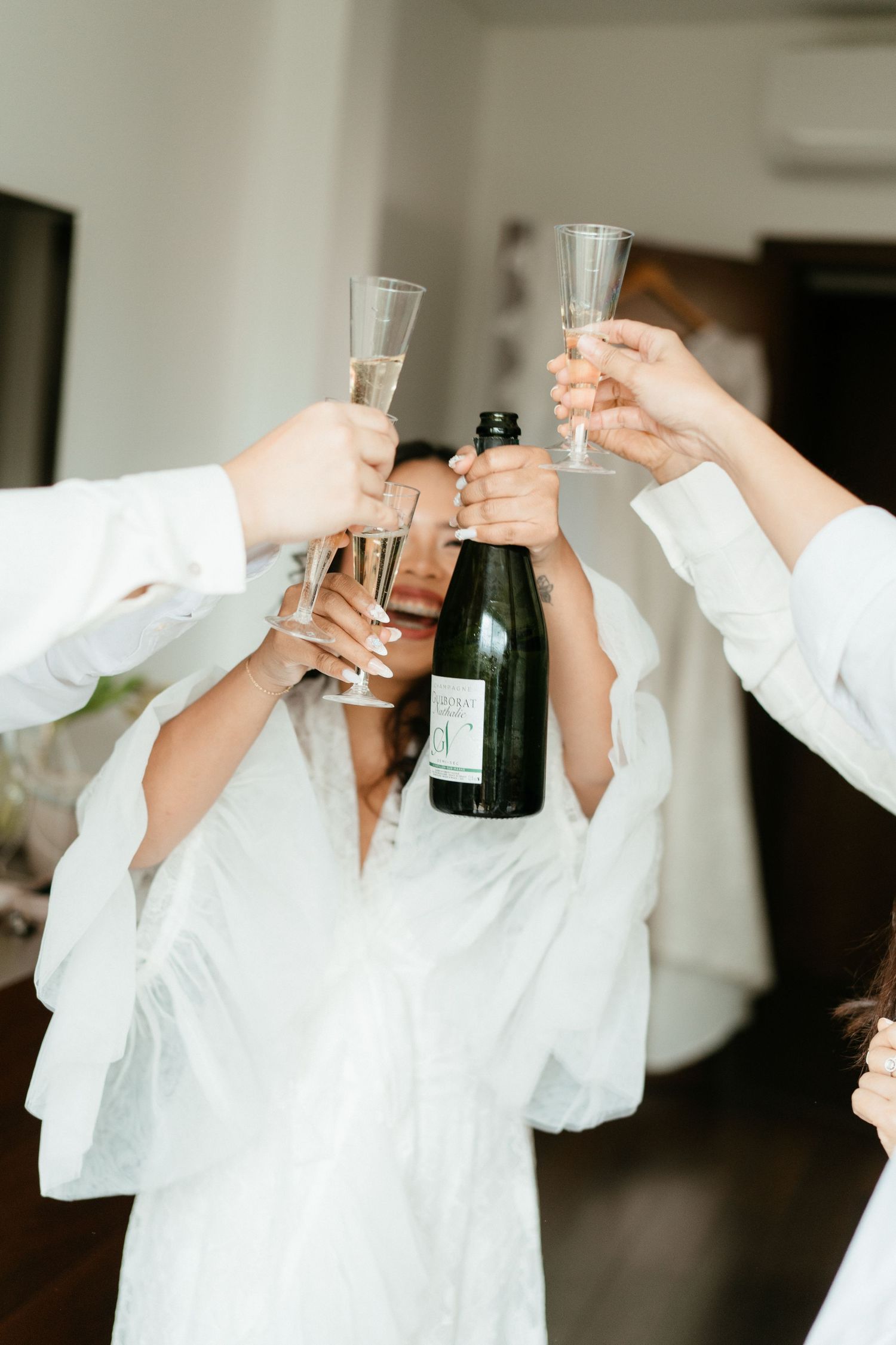 Bridesmaids toasting with champagne during wedding morning preparations, destination wedding Portugal