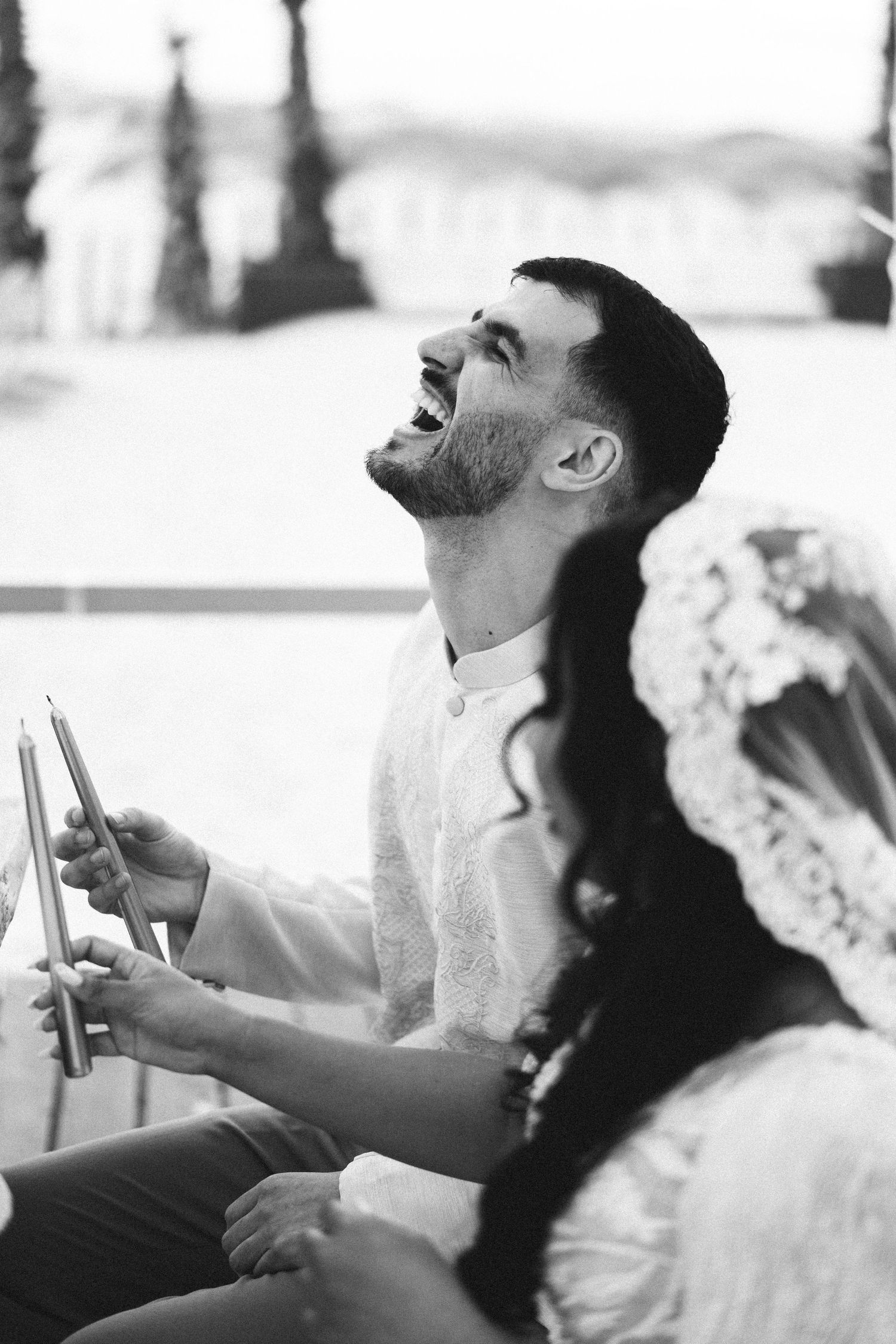 Bride and groom during beach wedding ceremony at Praia da Azurara near Porto Portugal