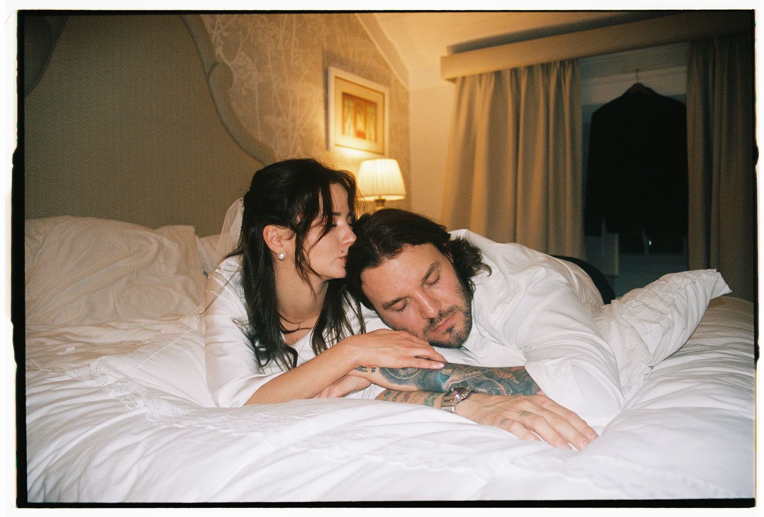 Couple lying together on hotel bed after elopement, film photography Estoril Vintage Hotel Lisbon