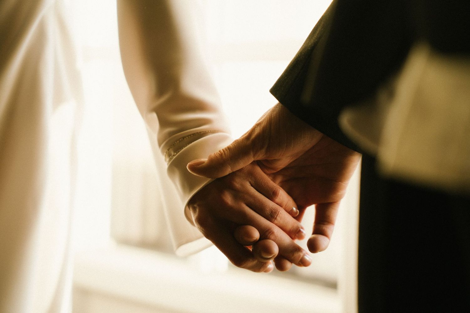 Bride and groom holding hands during intimate elopement, documentary wedding photography Lisbon