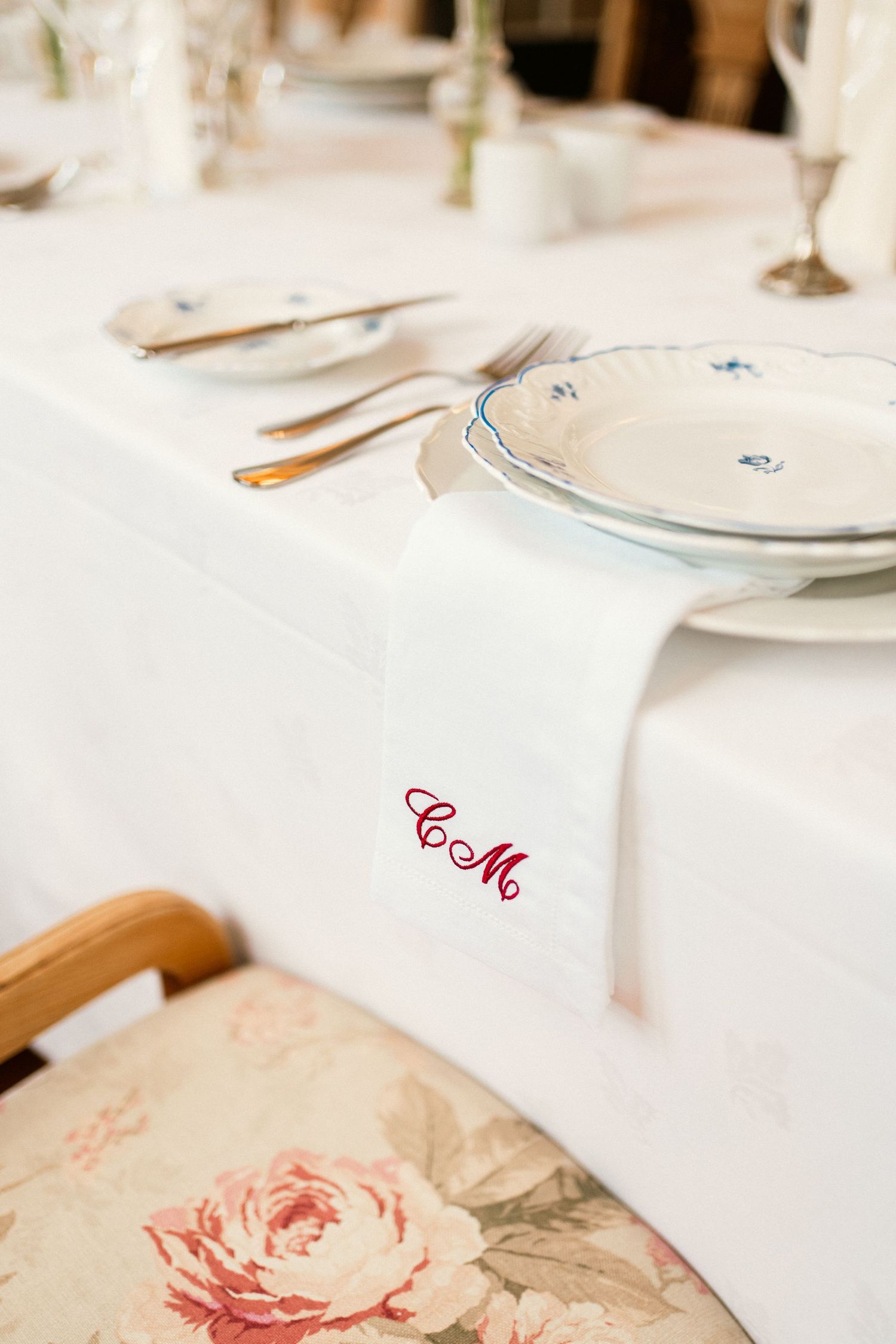 A beautifully set wedding table with an embroidered monogram tablecloth at an intimate elopement in Sintra, Portugal