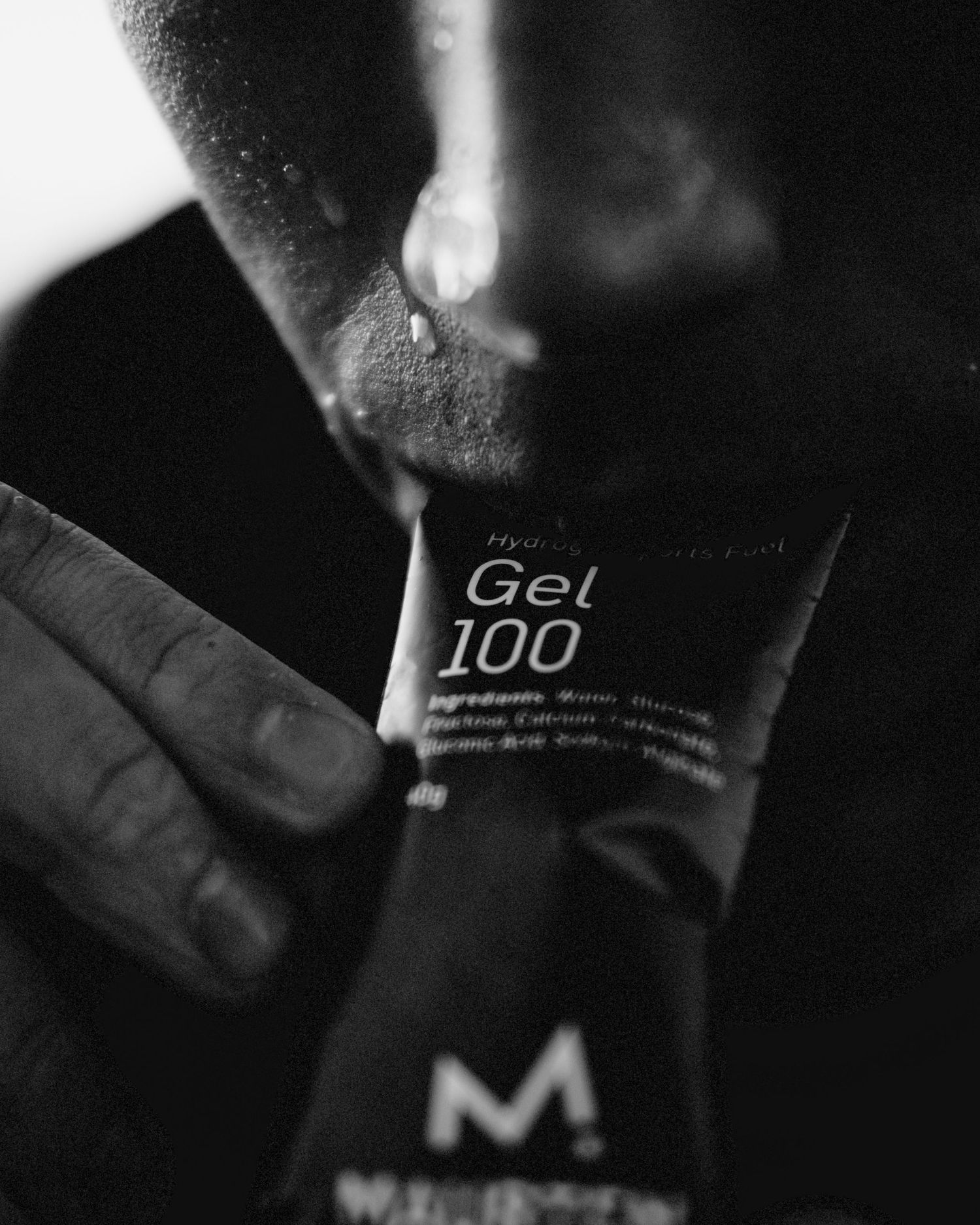 Macro shot of product cards showing text and branding details in black and white.