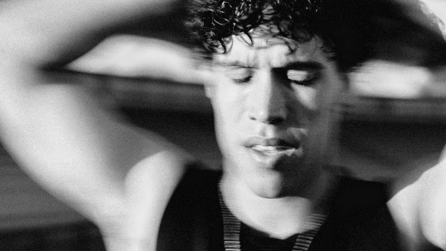 Artistic black and white portrait, dramatic lighting.