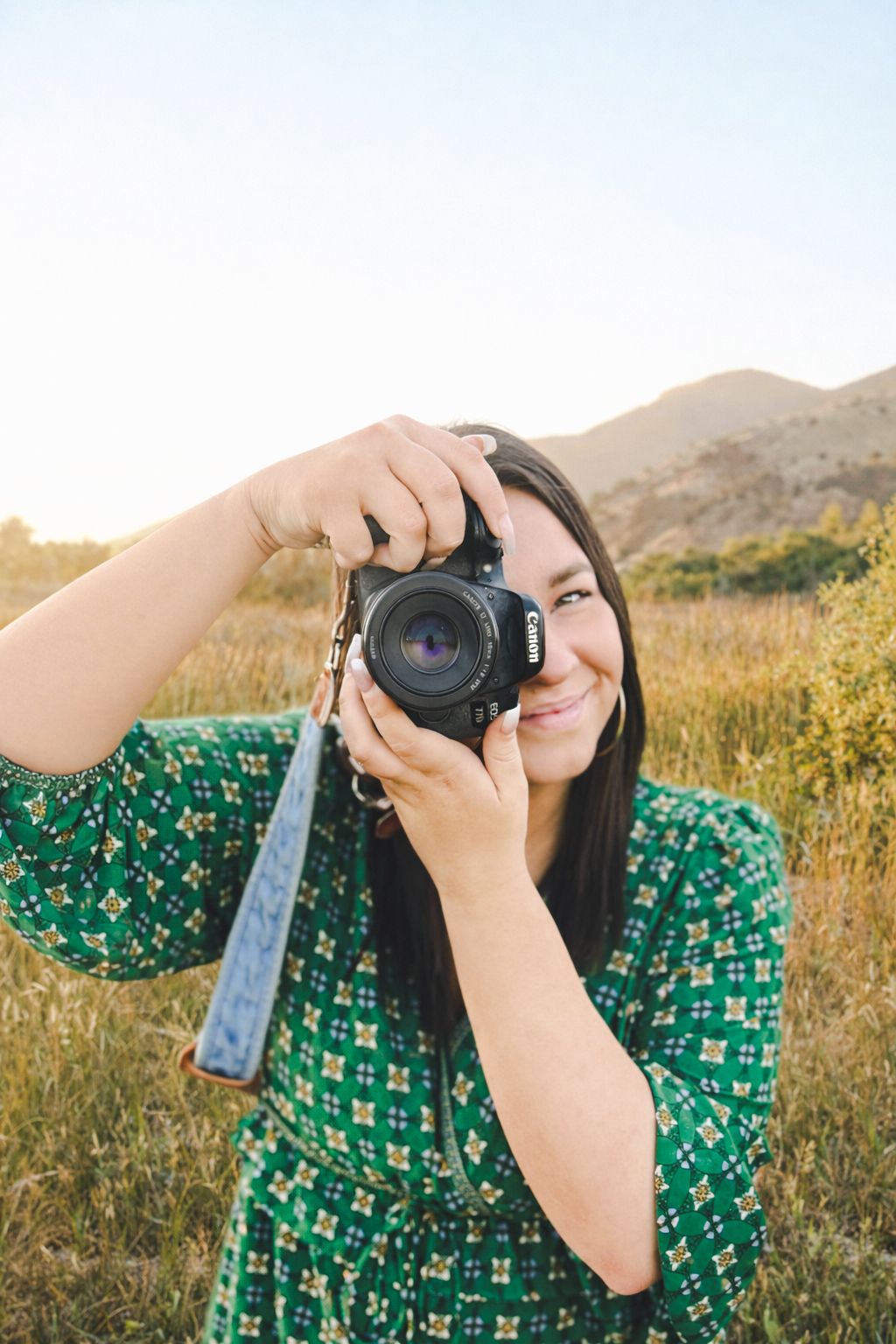 Photographer with her camera getting ready to take a picture.