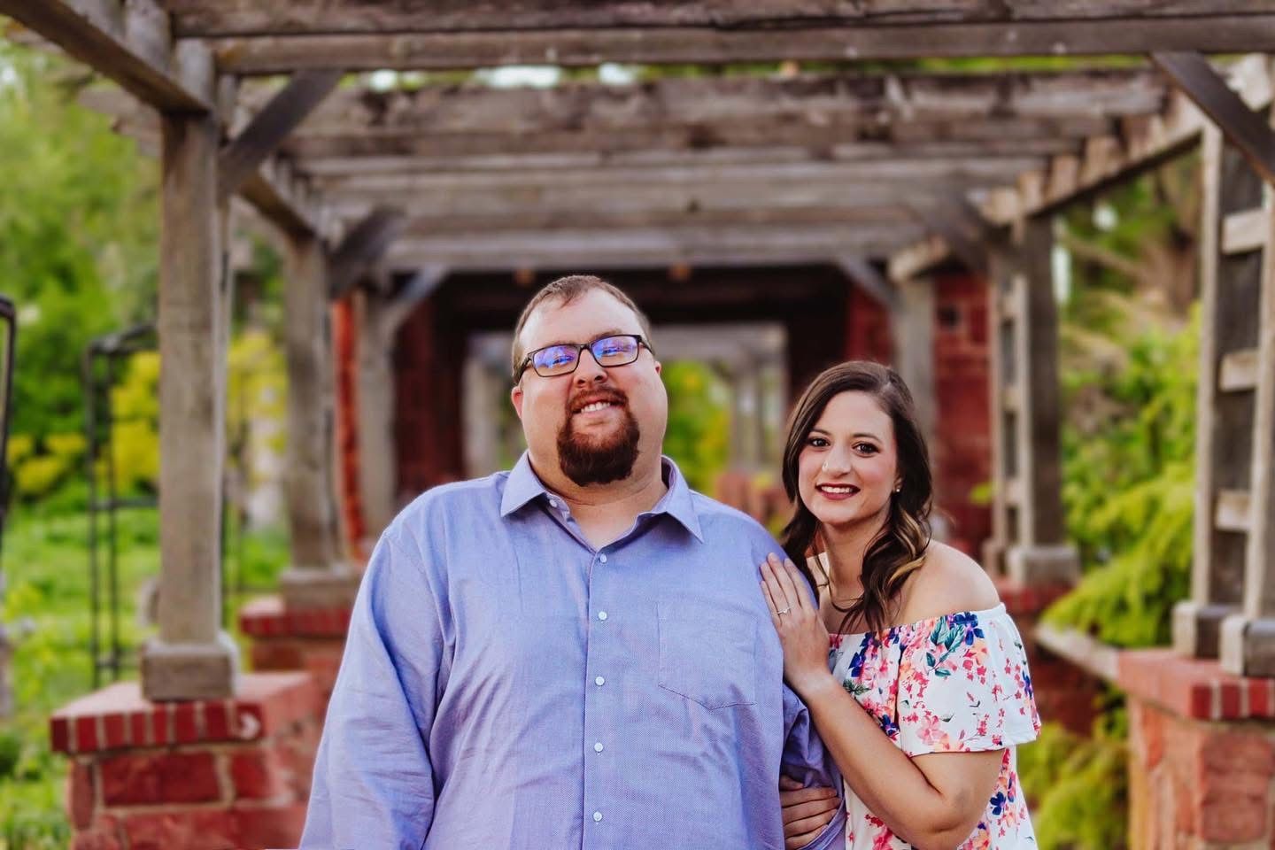 Couple under a pergola.