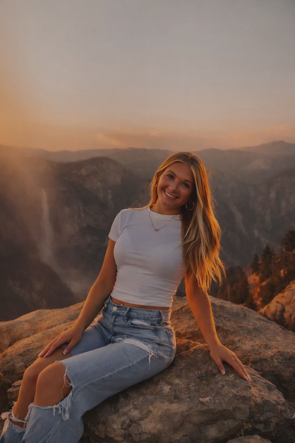 A brunette girl sitting on a rock.