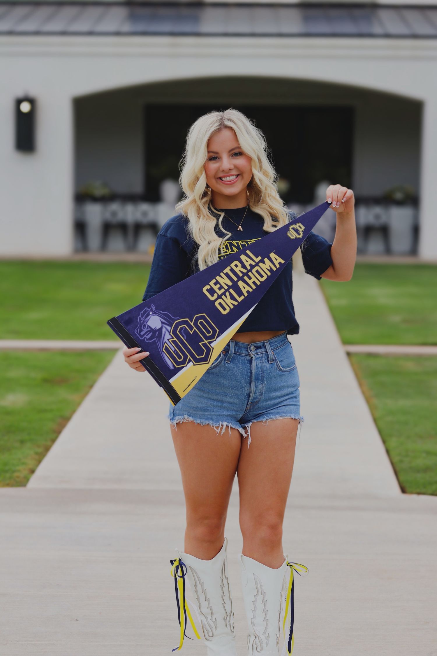 A blonde senior committing to go to college at the University of Central Oklahoma.