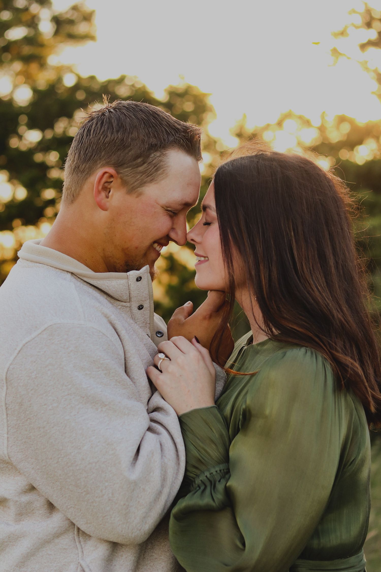 Young couple smiling with their foreheads touching.