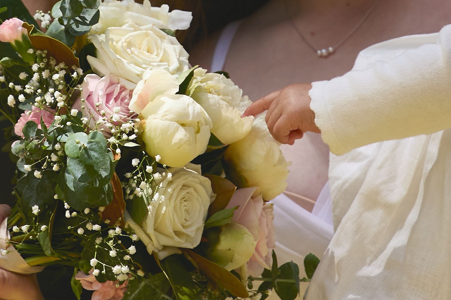 Close up details of wedding bridal bouquet flowers and dress by Monica Lope