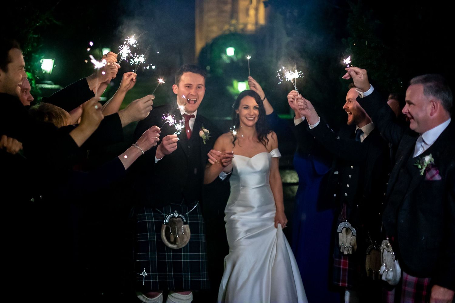 Wedding sparkler exit photography capturing candid moments by Monica Lopez