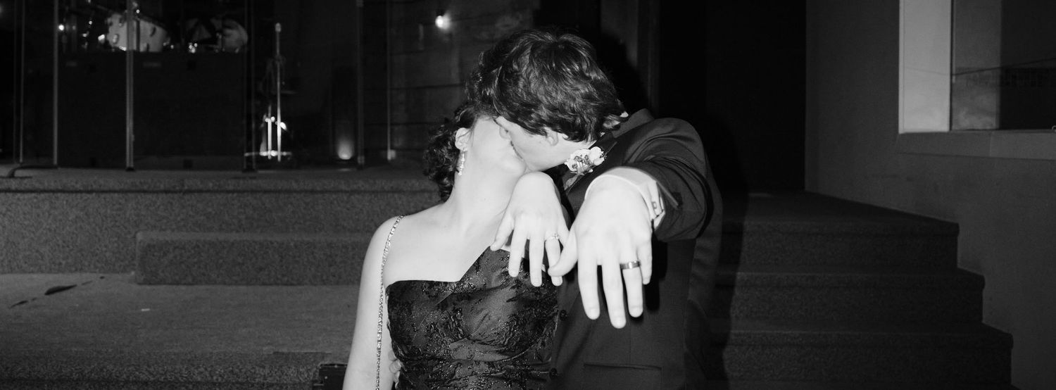 N&D Wedding Photography and Film, an image of a bride and groom kissing while showing their rings. Seattle, WA 2026