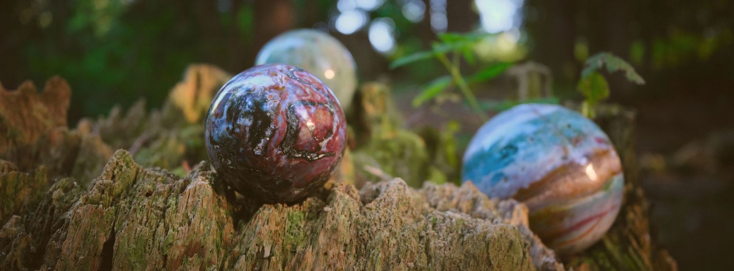 A photo of Foggé Crystal Company spheres in a Washington State forest. Photo by N&D Wedding Photography and Film