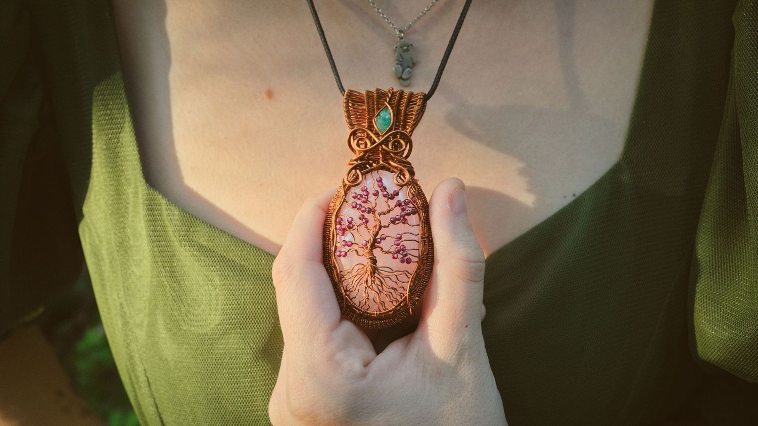 A photo of a Foggé Crystal Company necklace in a Washington State forest. Photo by N&D Wedding Photography and Film