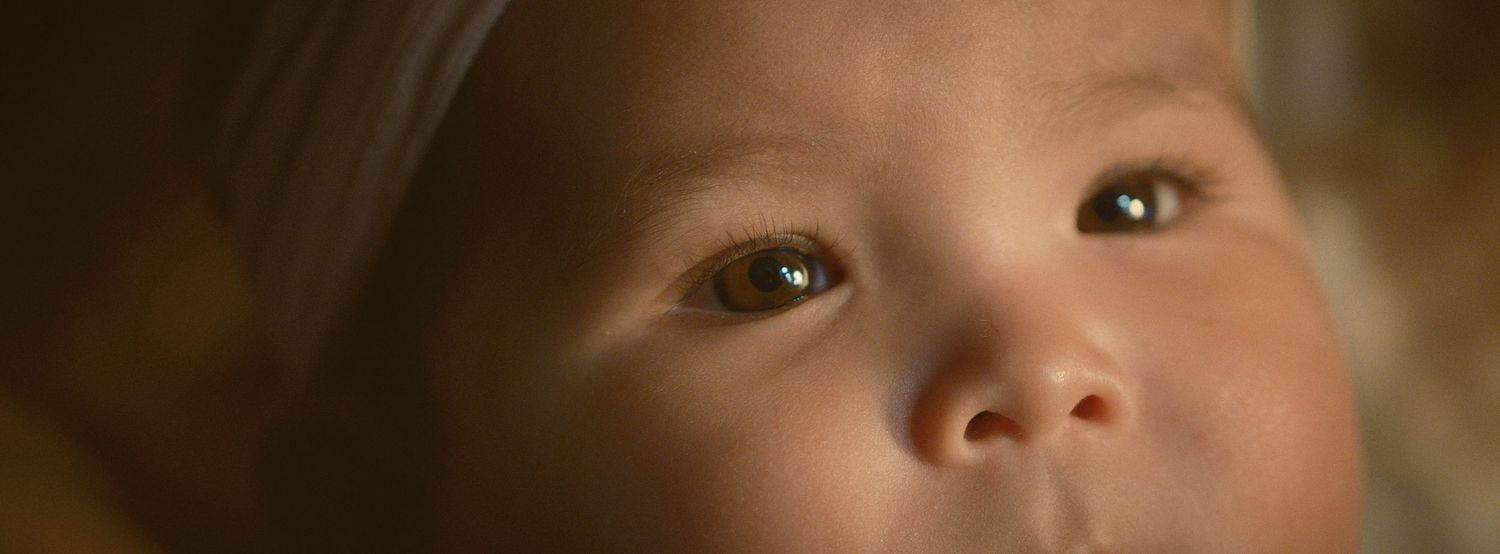 A close up image of a baby's eyes, taken in Snohomish County, Washington State. Photo by N&D Wedding Photography and Film