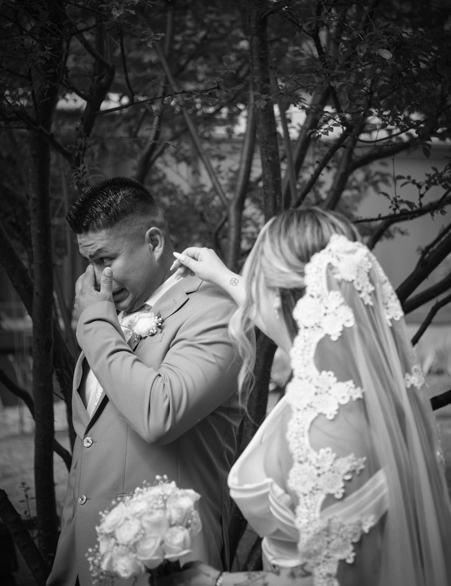 A groom cries seeing his bride during the first look in Tulalip Washington. Photo by N&D Wedding Photography and Film