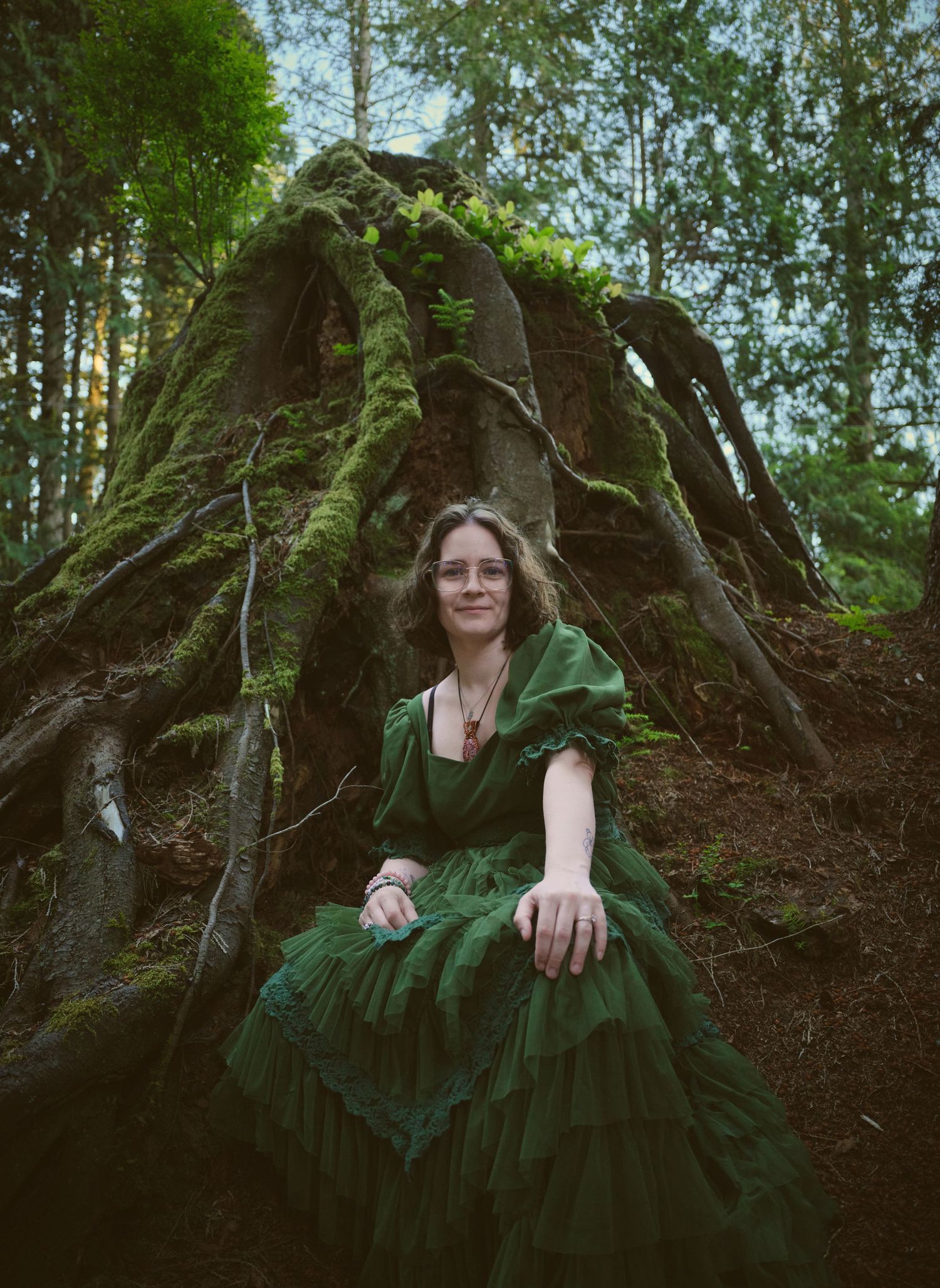 Fogge Crystal Company owner Miranda sitting in a Snohomish County, Washington State forest. Photo by N&D Wedding Photography and Film