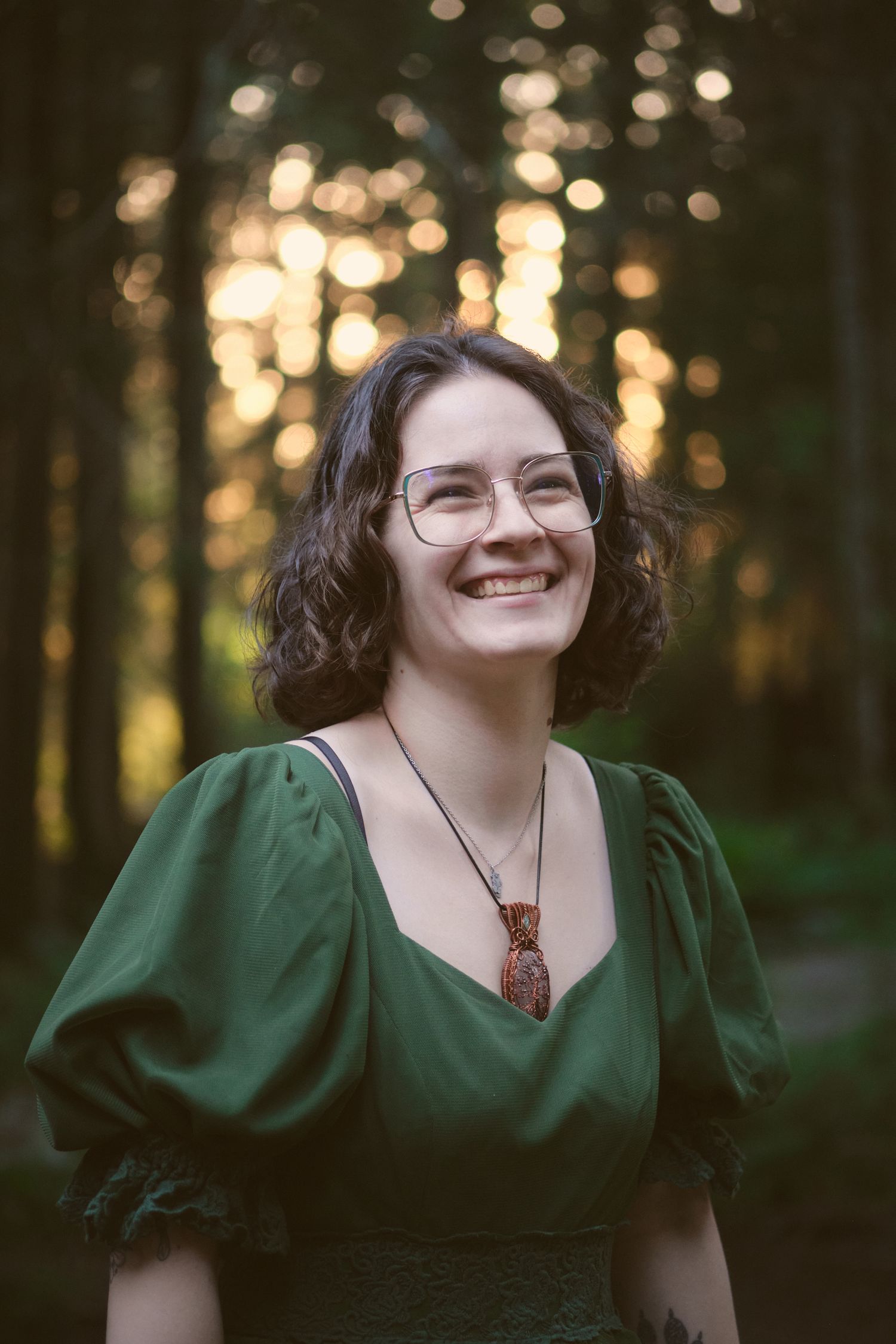 Miranda Foggé laughing in a Snohomish County, Washington State forest. Photo by N&D Wedding Photography and Film