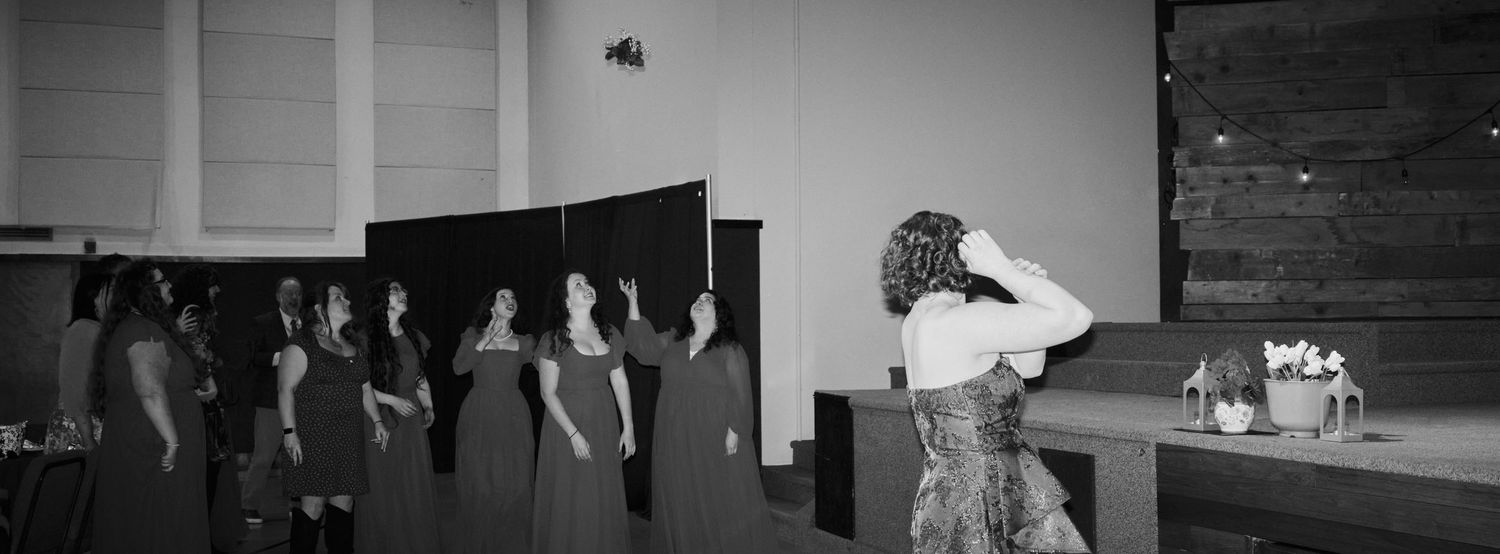 N&D Wedding Photography and Film
This is a candid photo of a bride tossing her bouquet at a wedding in Bothell, WA.
