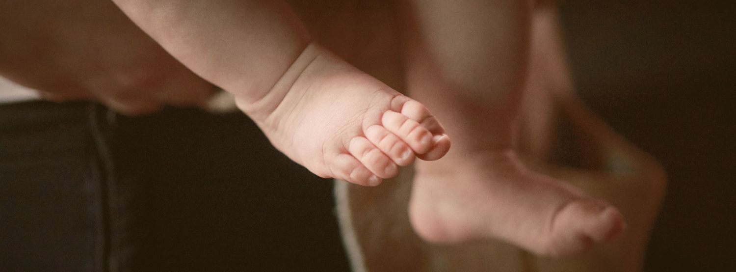 A photo of a baby's foot, taken in Snohomish County, Washington State. Photo by N&D Wedding Photography and Film