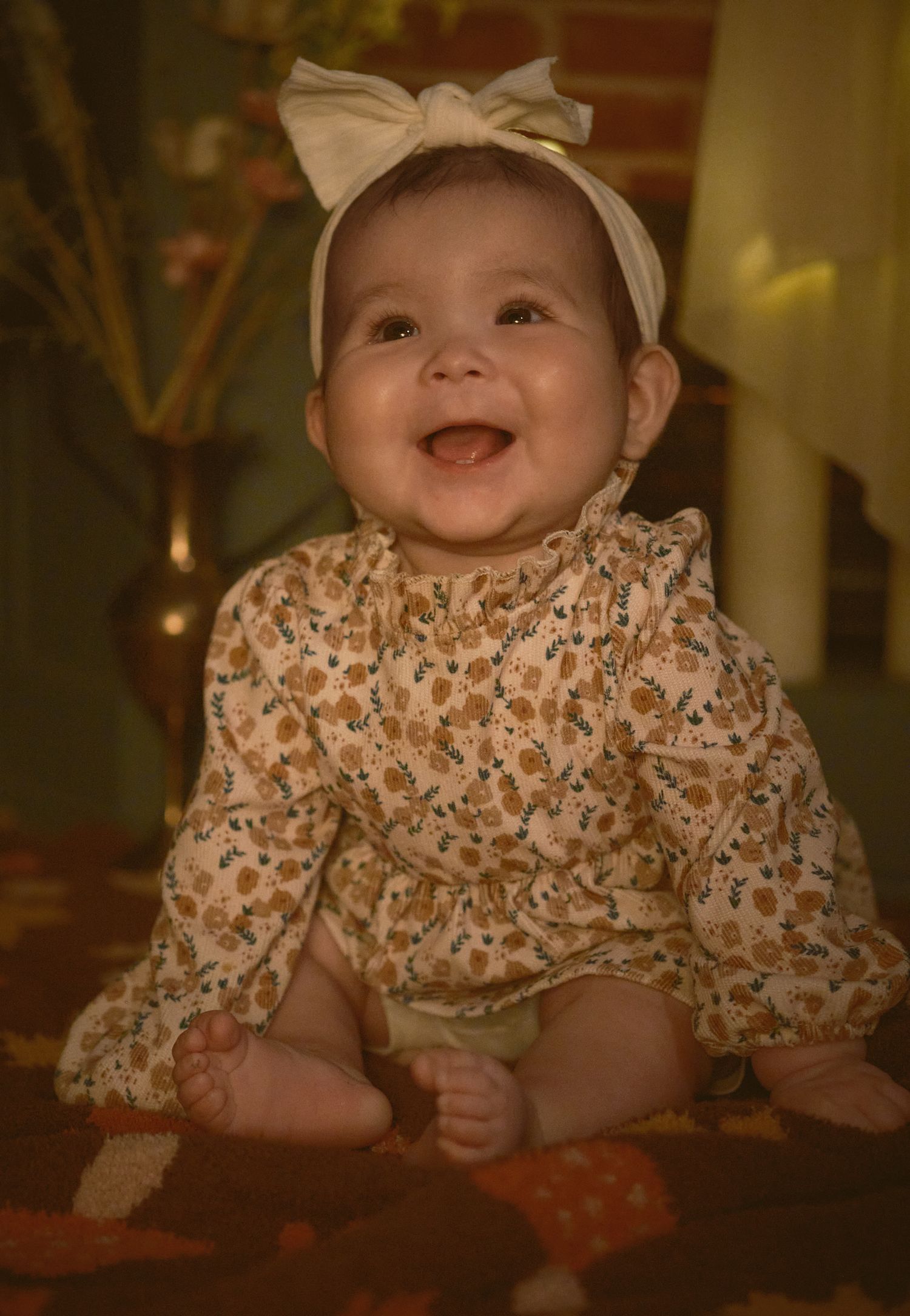 A photo of a baby laughing, taken in Snohomish County, Washington State. Photo by N&D Wedding Photography and Film