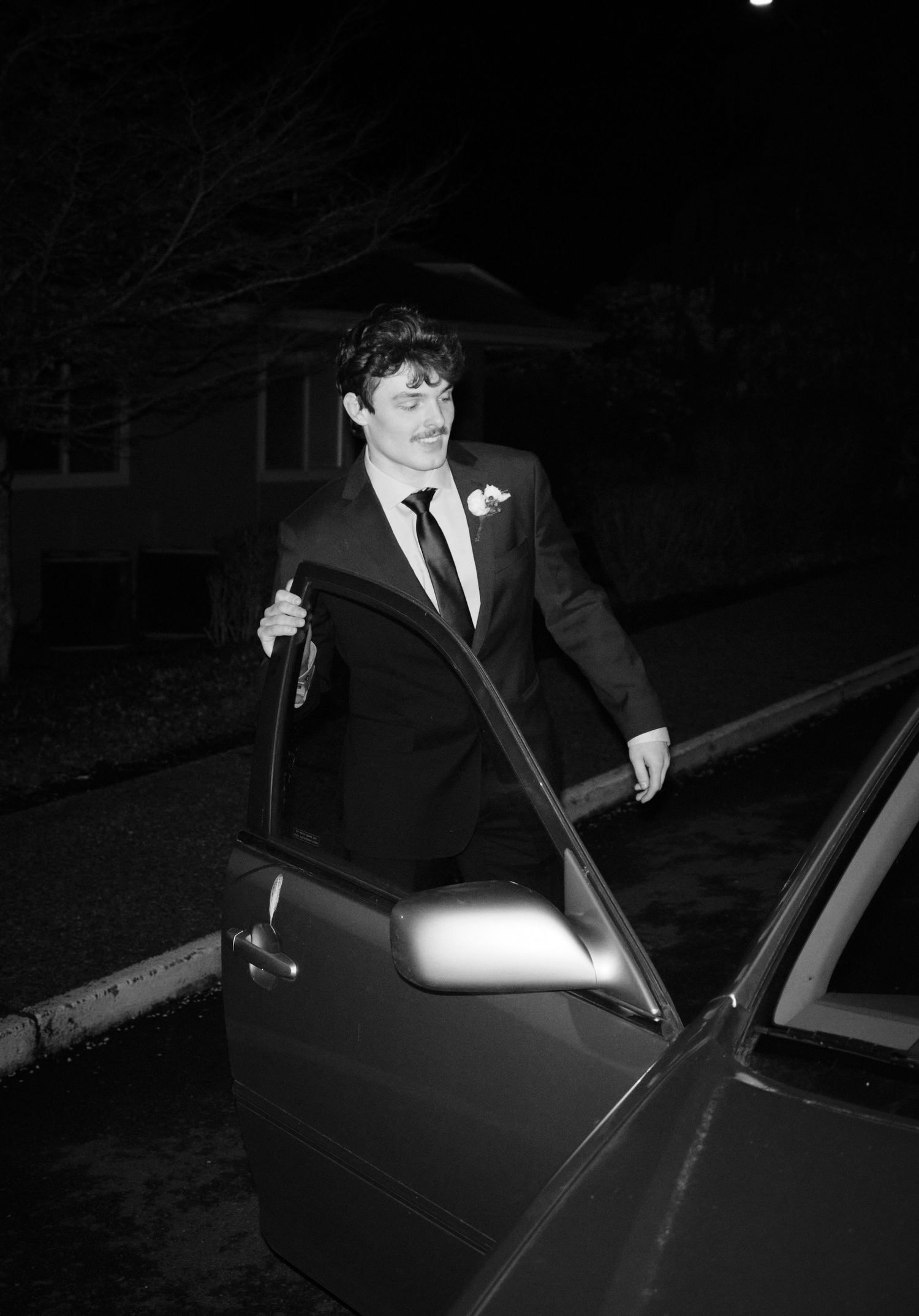 N&D Wedding Photography and Film, an image of a groom opening a car door. Seattle, WA 2026