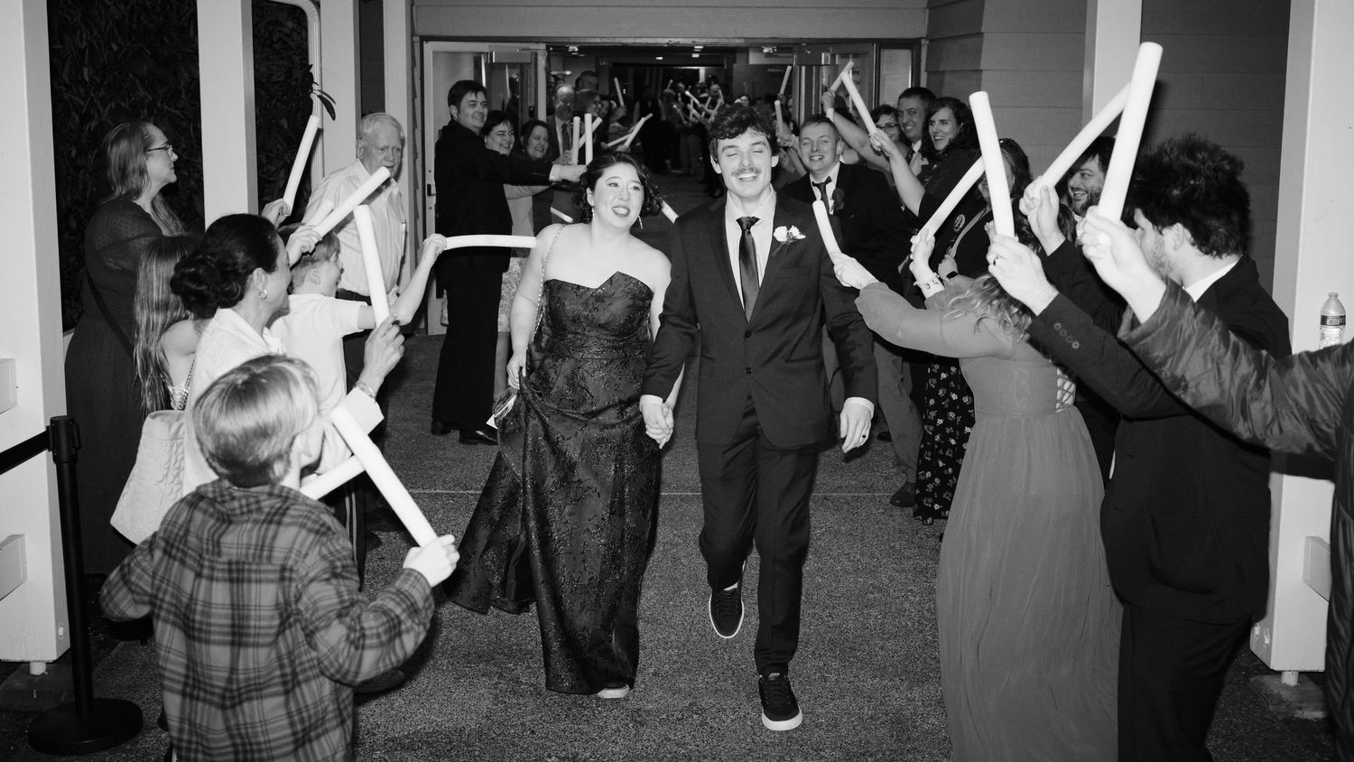 N&D Wedding Photography and Film
This is a candid photo of a bride and groom traveling through a glow tube tunnel in Bothell, WA.