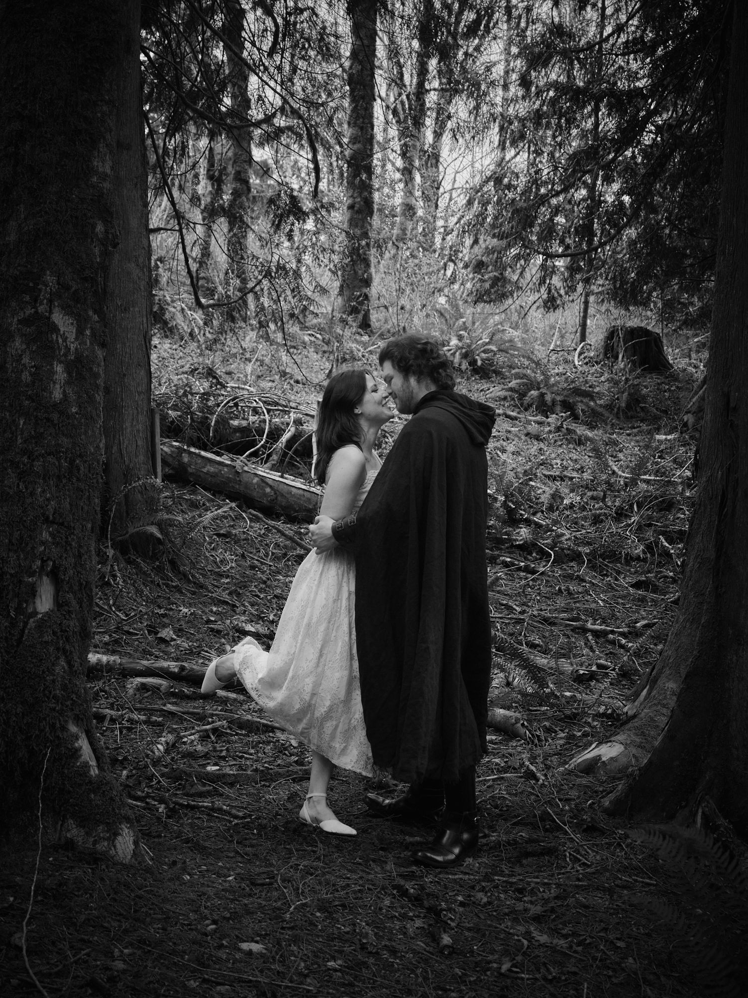 A couple about to kiss in a Washington State forest. Photo by N&D Wedding Photography and Film