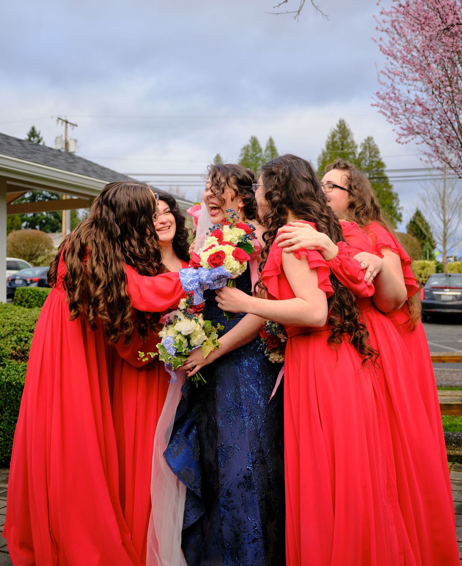 N&D Wedding Photography and Film
A candid photo of a joyful bride getting surprised hugged by her bridesmaids, taken in Bothell, Washington