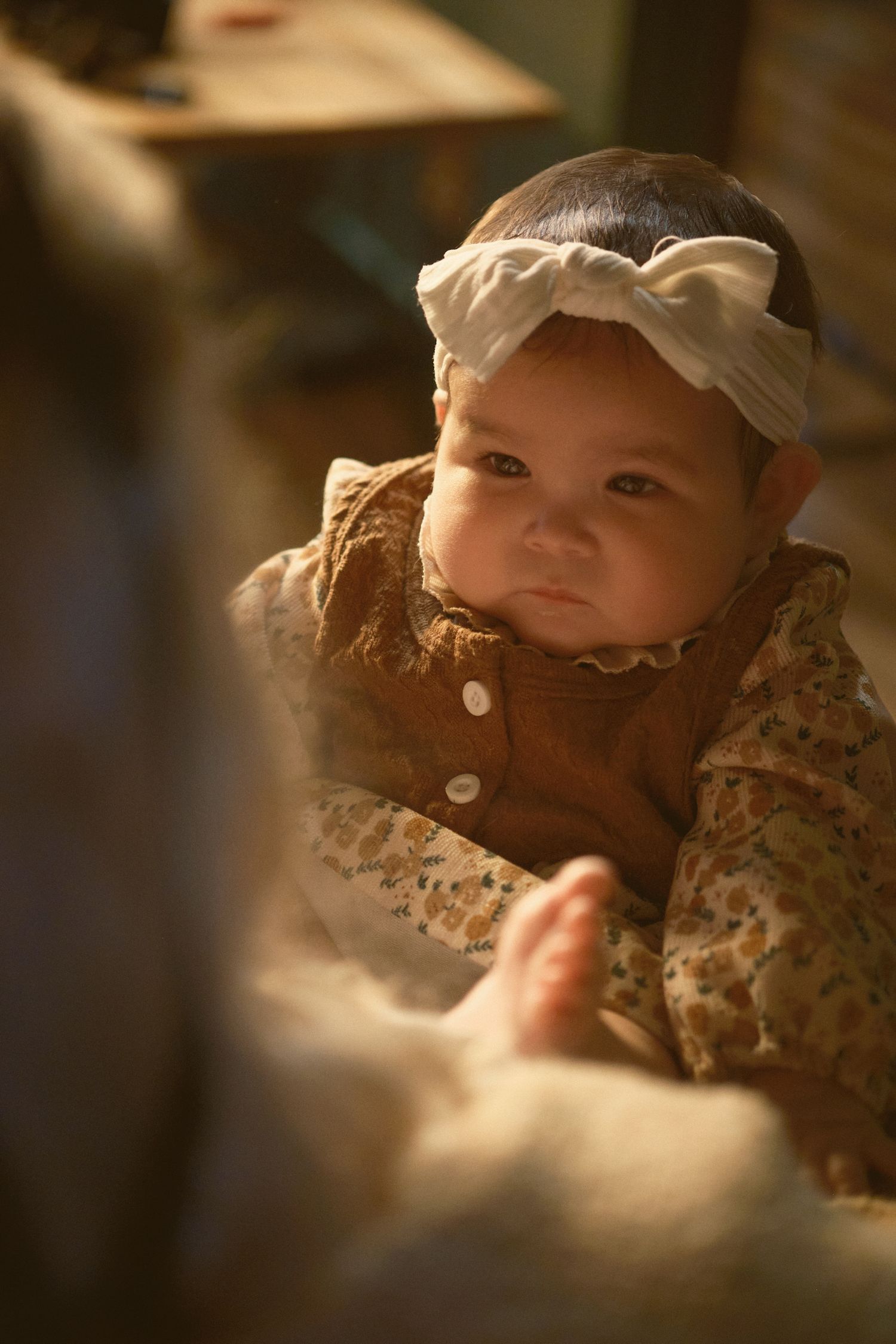 An image of a baby staring at her mother, taken in Snohomish County, Washington State. Photo by N&D Wedding Photography and Film
