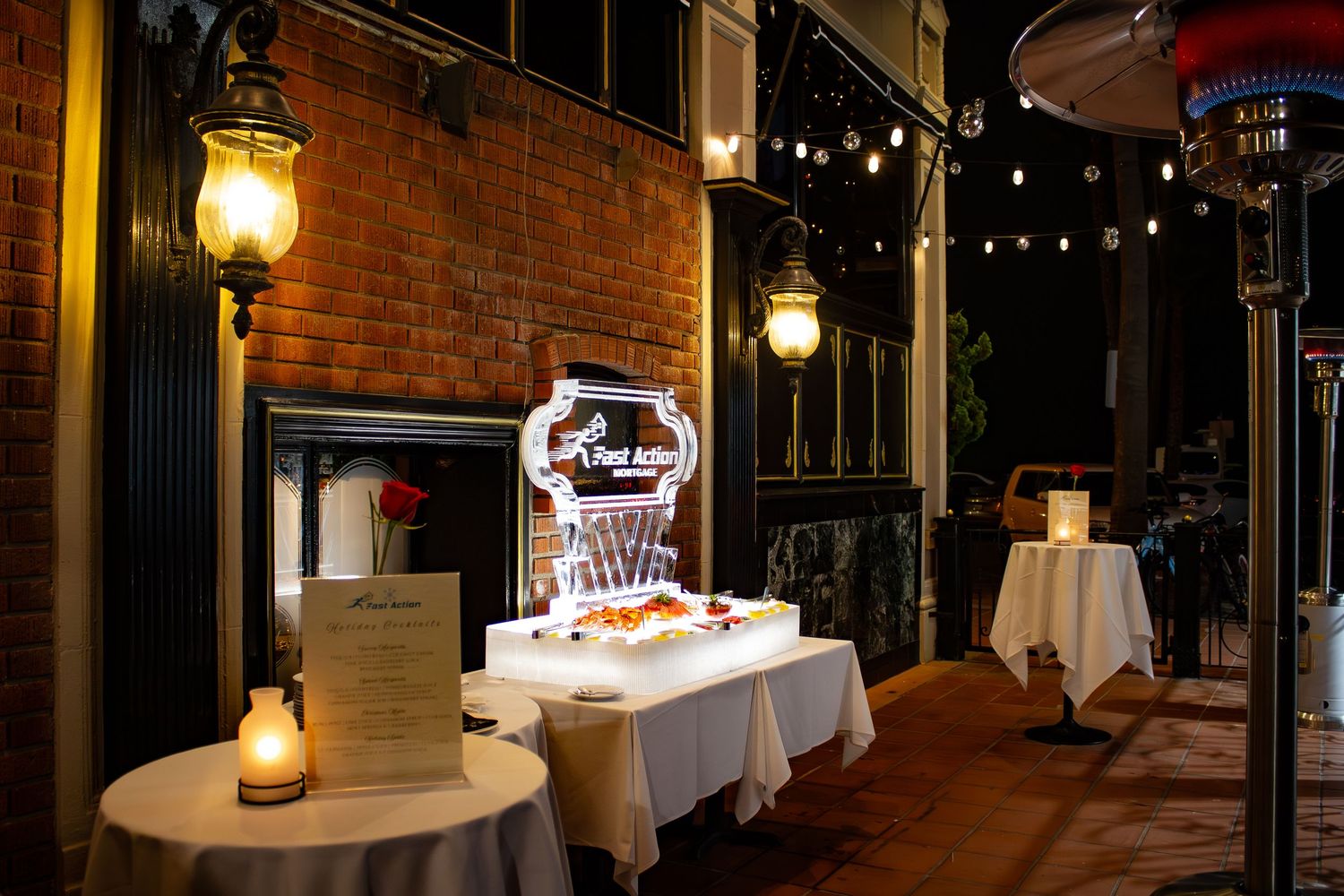 Rustic indoor venue with exposed brick walls and hanging lanterns creating intimate ambiance.