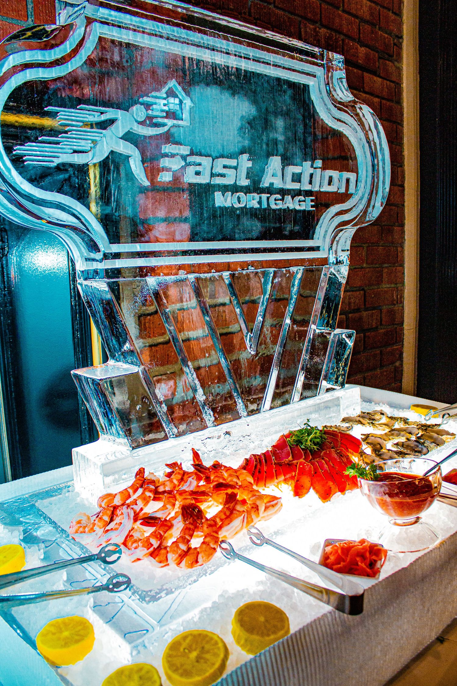 Ice sculpture seafood display with fresh shrimp and citrus garnishes.