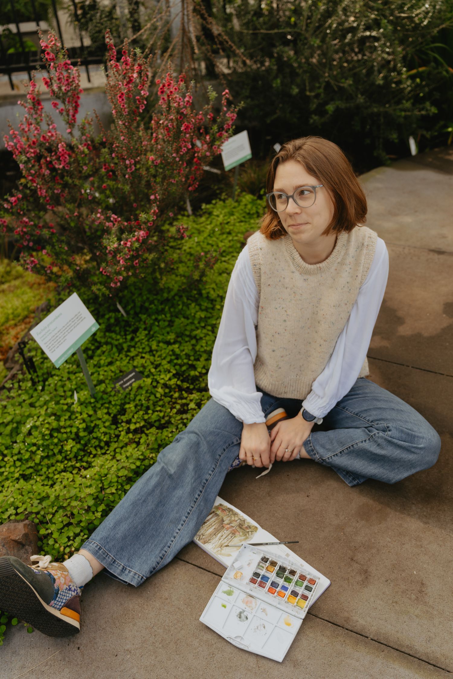 Artist posing in a conservatory