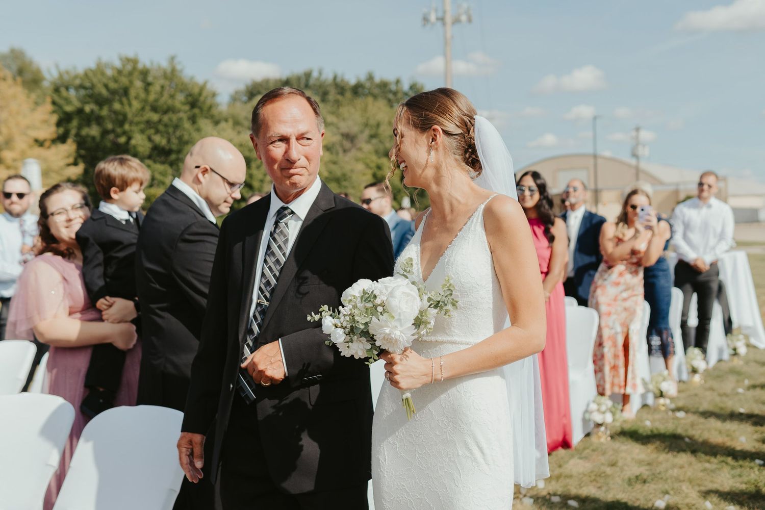 Bride and her father walking down the aisle.