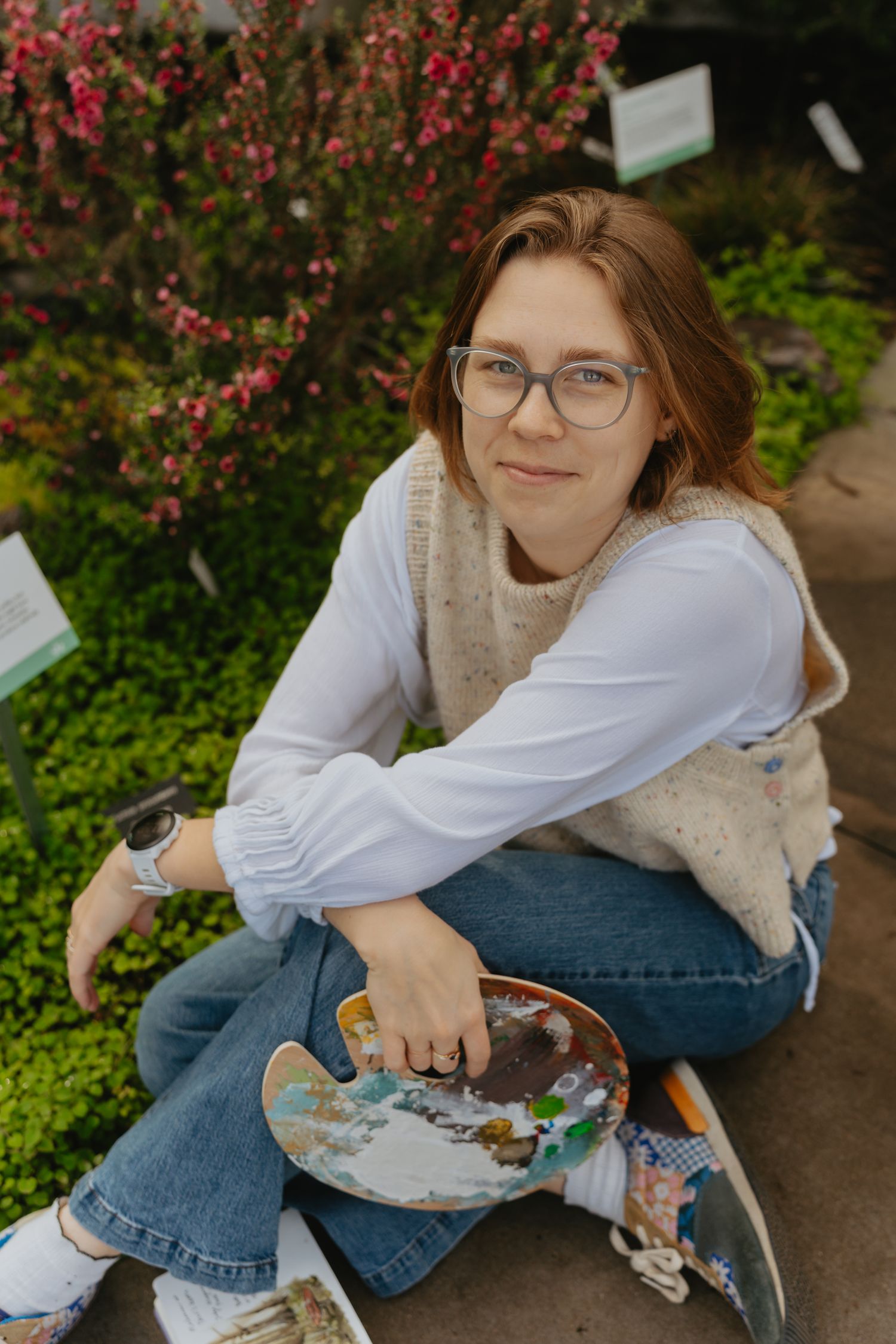 Artist posing in a conservatory